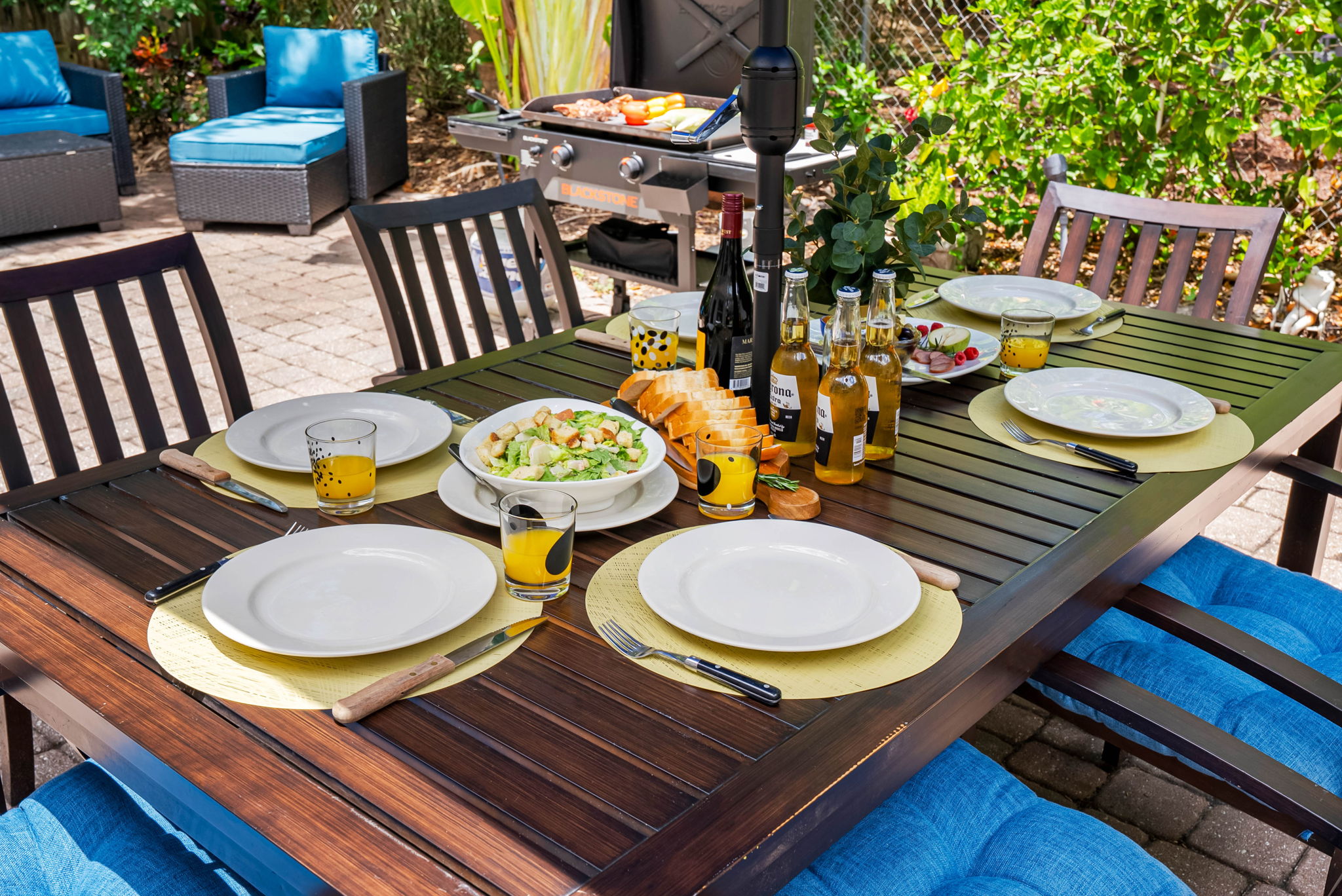 With a spacious dining set, cozy conversation area, and lush landscaping, it’s made for memorable meals and meaningful moments.