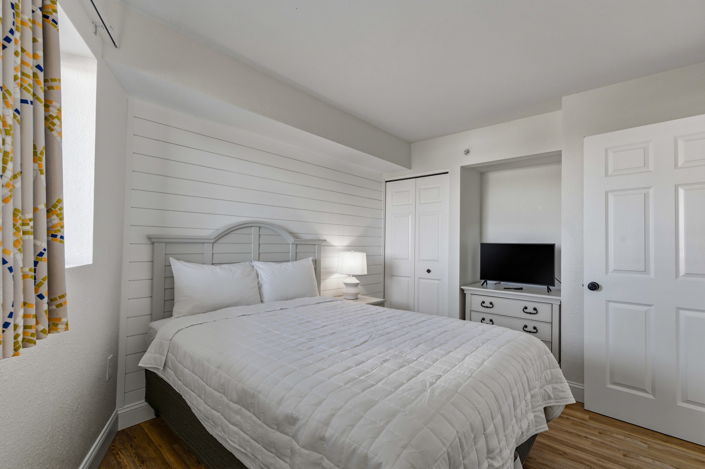 Bedroom with bed and TV