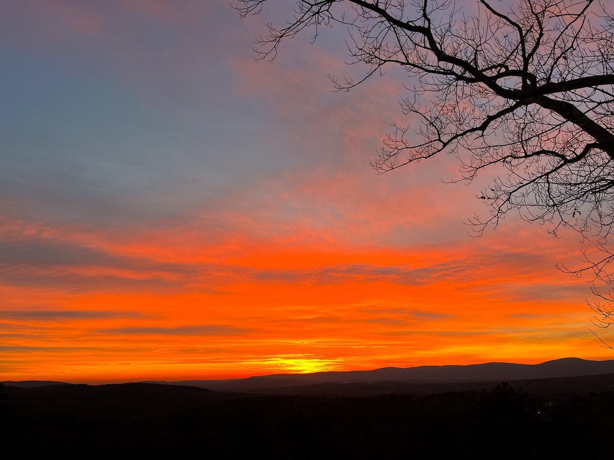 Rayleigh-scattering red sky over the Berkshires mountains at sunset &mdash; Sunset Falls