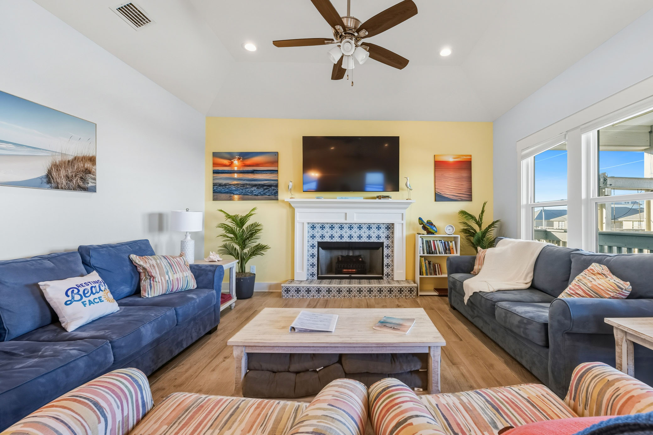 Comfortable living room with 2 sofas, 2 chairs, electric fireplace and a 65" TV with Netflix and YouTubeTV