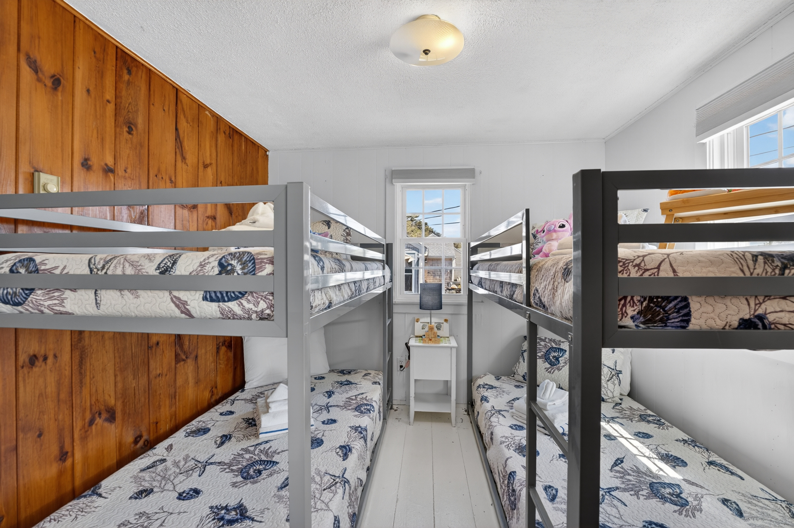 Welcome to our second bedroom with two sets of twin bunk beds! Perfect for shared adventures and sweet dreams!