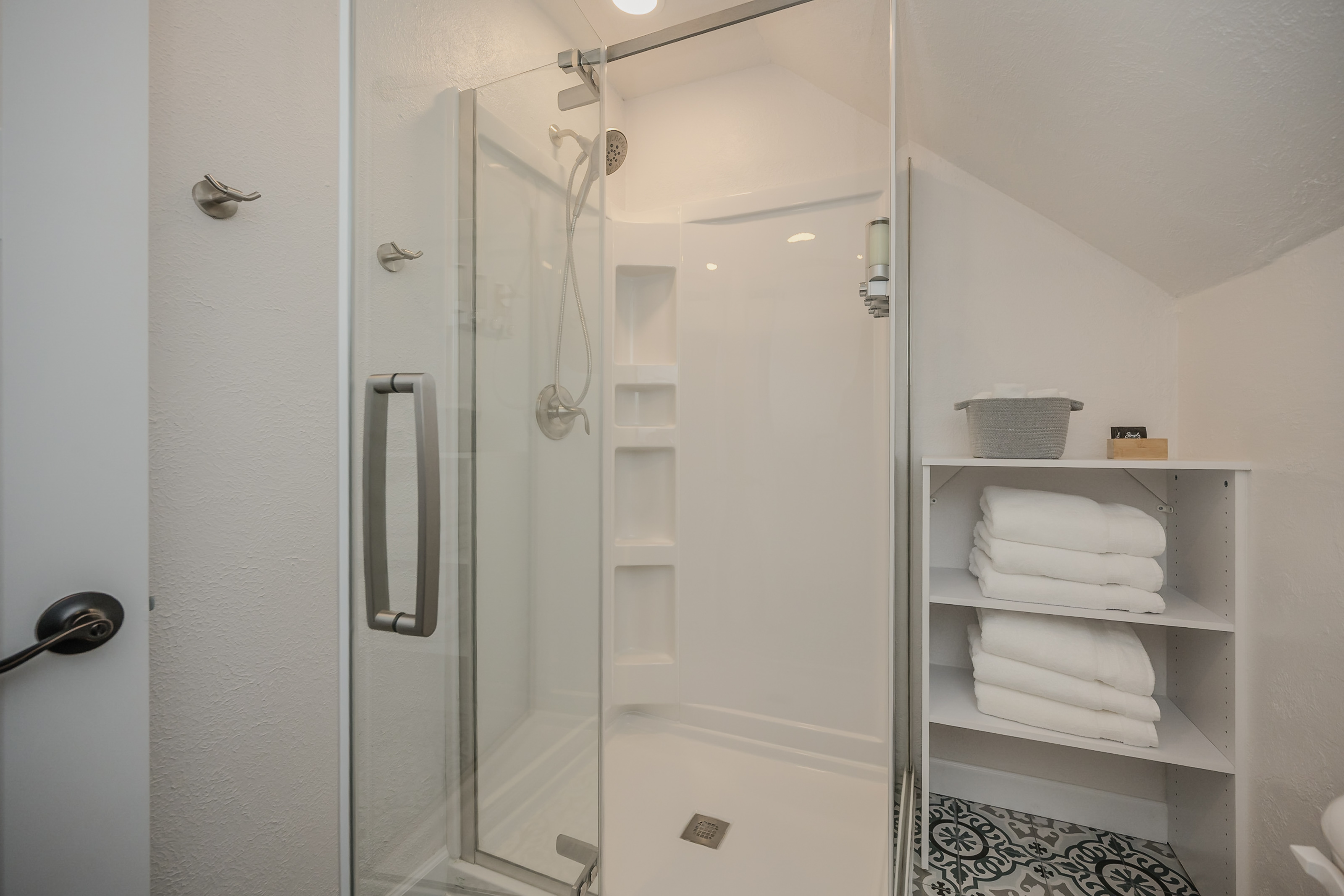 The beautiful shower has great water pressure.