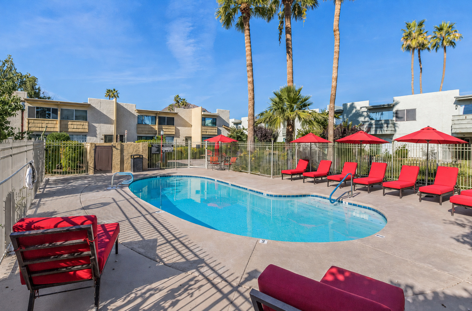 Shared community pool with lounge seating