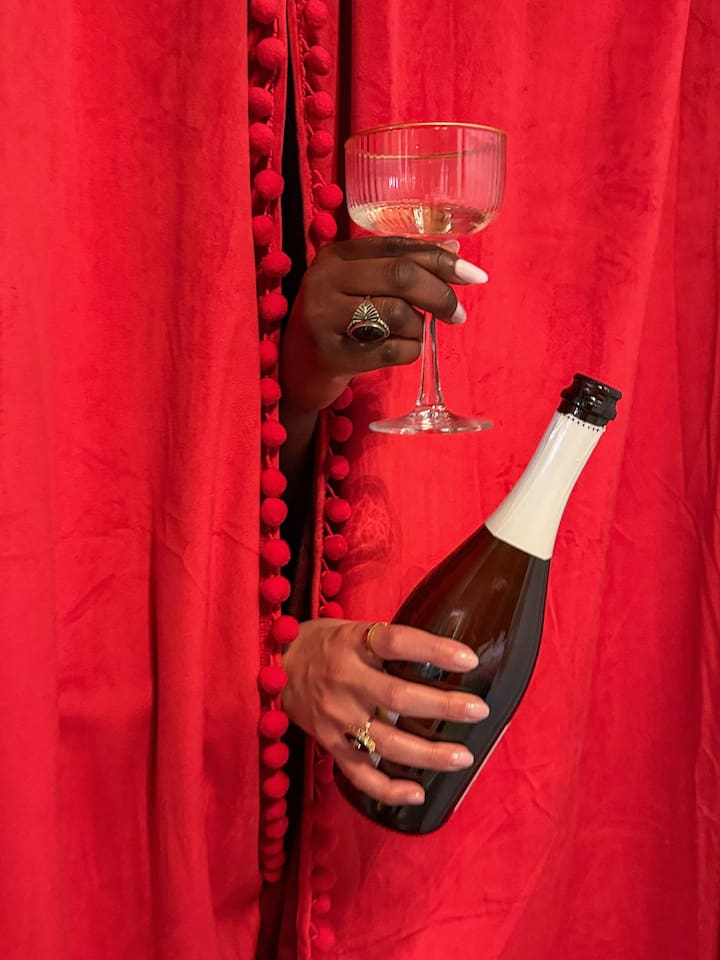 Pop champagne inside the private speakeasy booth for unforgettable girls-trip photos. This  playful hidden lounge adds a one-of-a-kind nightlife vibe to your stay near the French  Quarter and Marigny. 