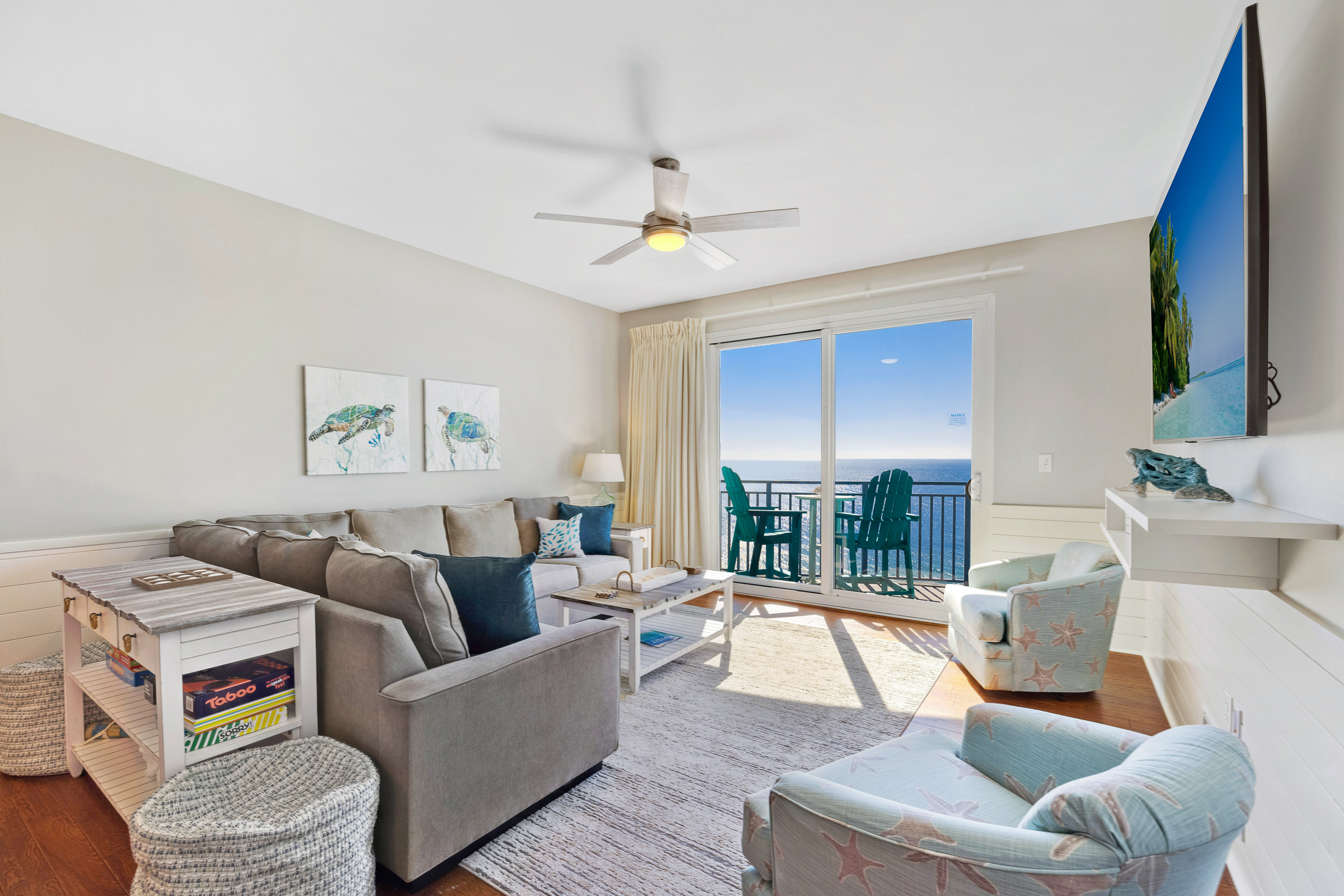 The sectional sofa, two captains chairs and two poufs (next to the console table) provide plenty of seating for hanging out in the living room.