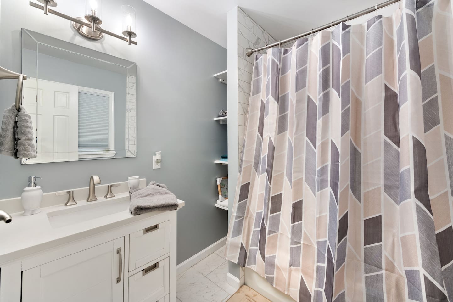 Spacious bathroom with double vanities and a large mirror — perfect for couples or families needing extra prep space.