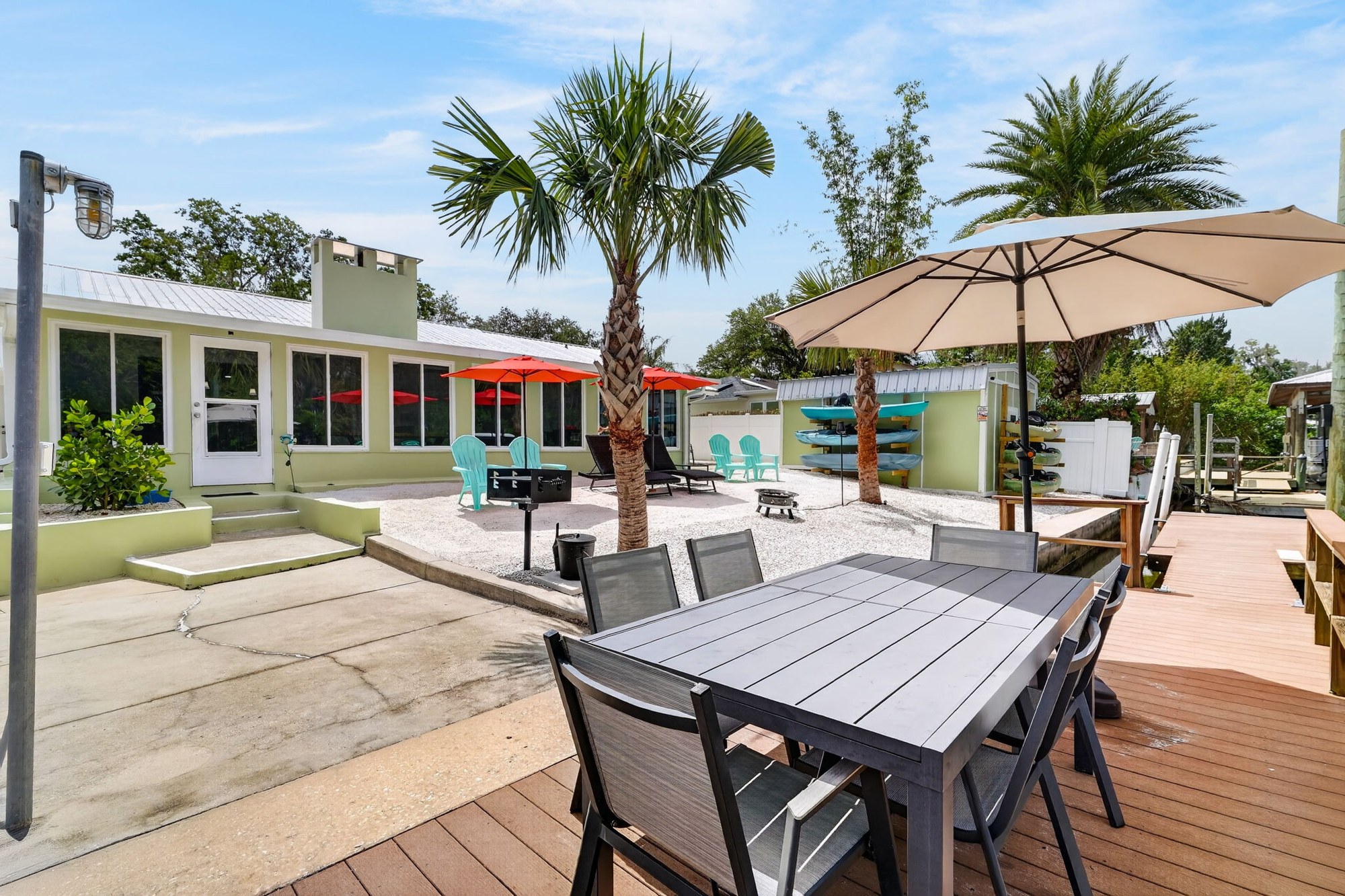 Patio dining table with umbrella on dock