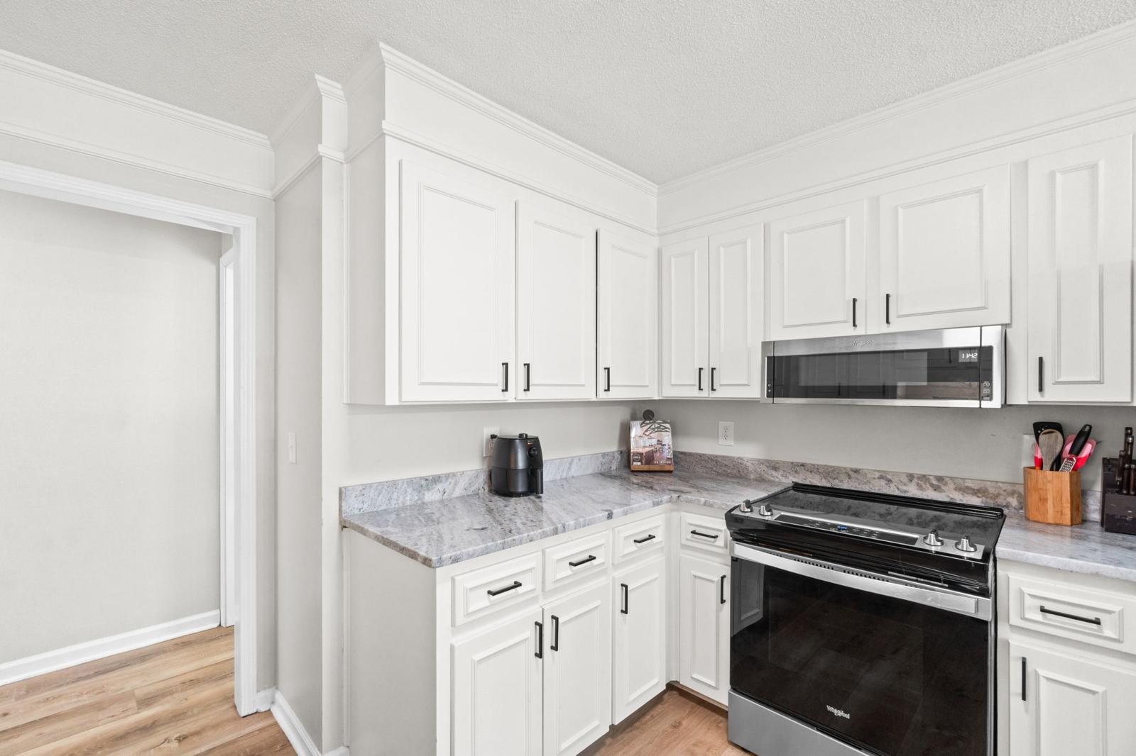 Kitchen with bar seating and all appliances