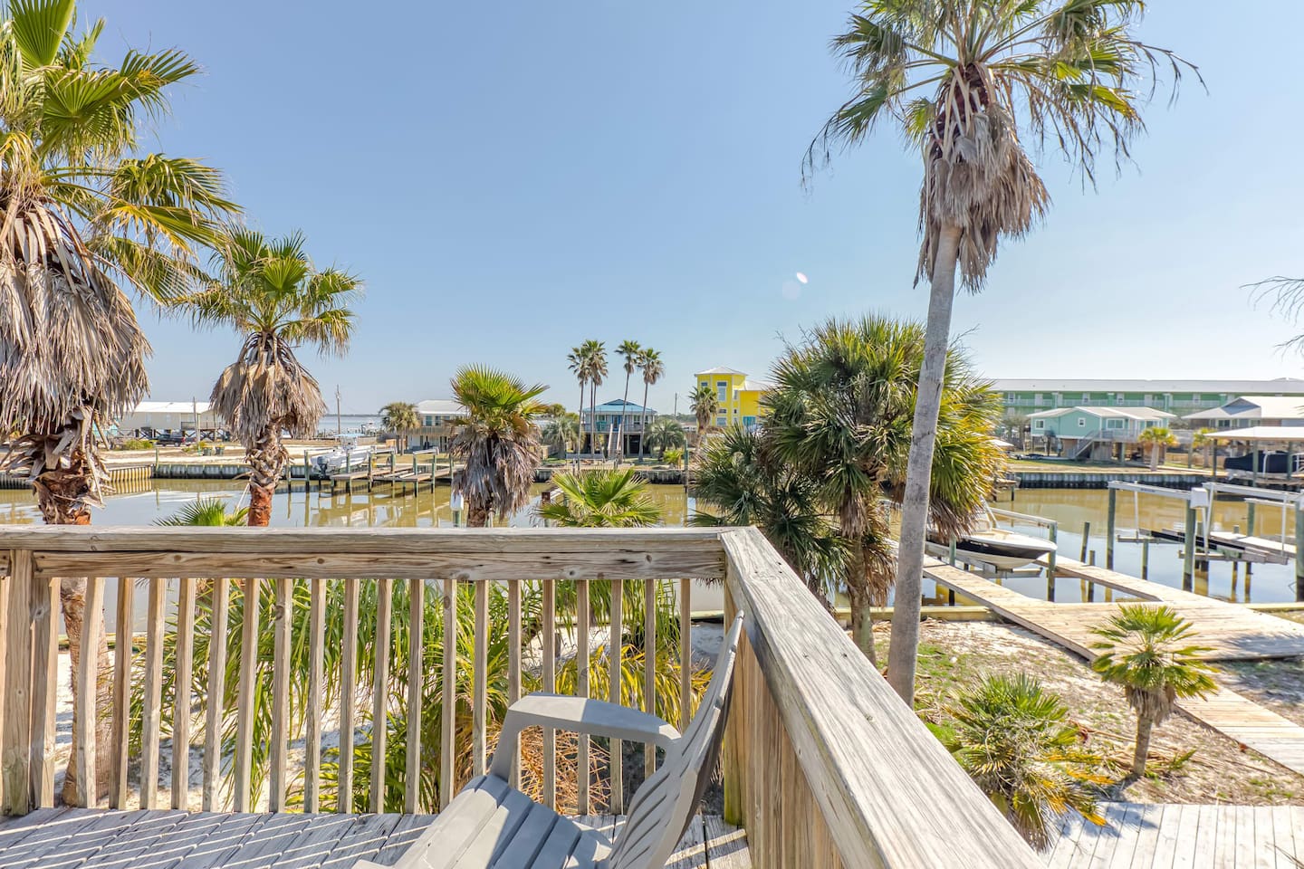 Deck: Savor stunning water views while lounging among swaying palm trees—pure Fort Morgan bliss!