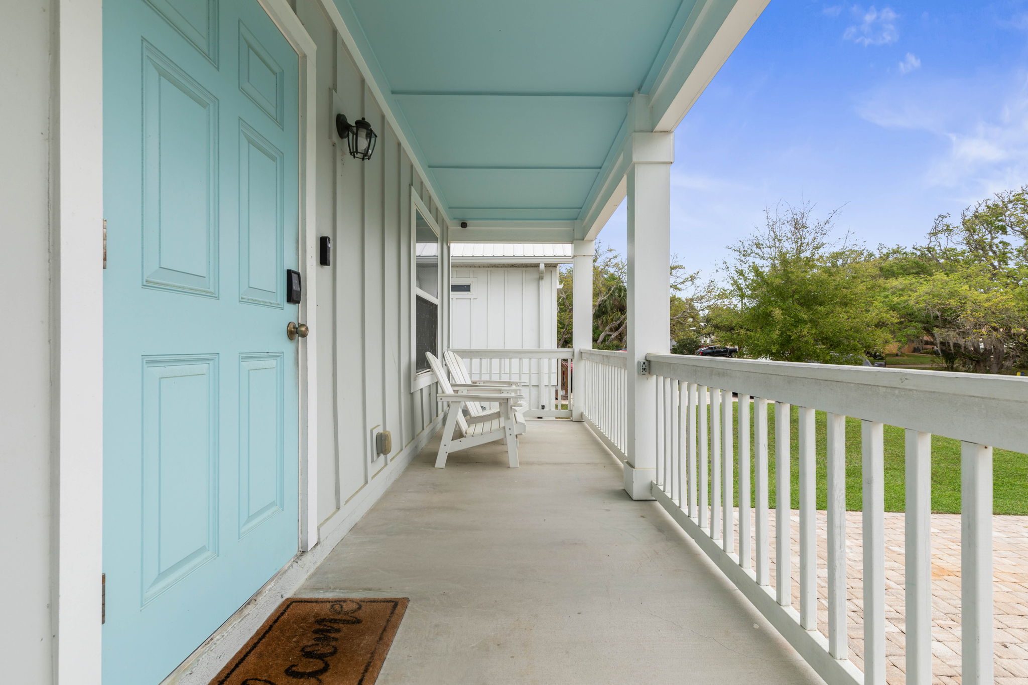 Arrive to a sky-blue door, sink into a porch chair with coffee, and let the pace slow down—this breezy coastal welcome sets the tone for beach days, sunset rides, and the kind of easy getaway that starts the moment you walk up.