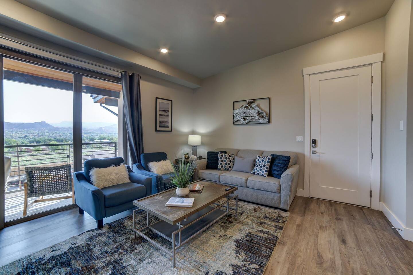 Open concept family room with fireplace and TV