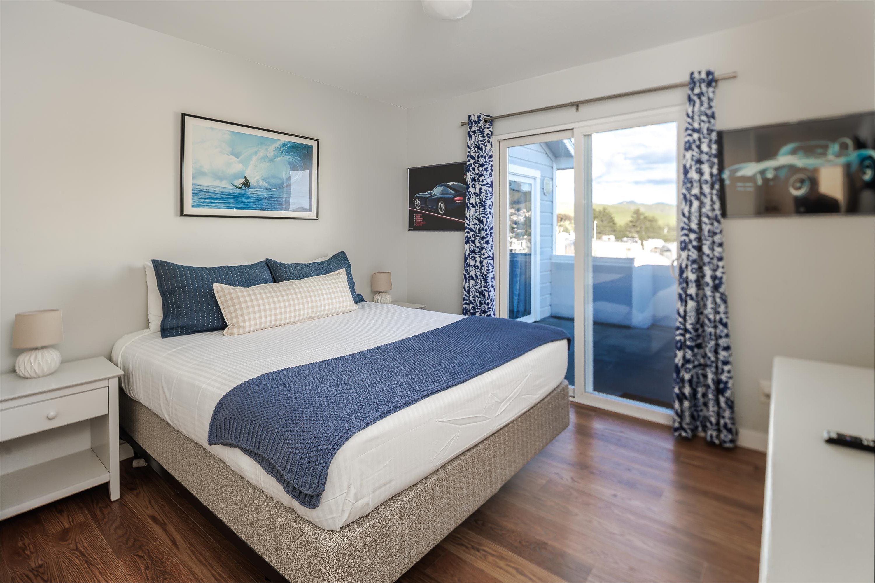 Wake up to warm colors, soft light, and your own private door to the deck — the perfect start to any beach morning.