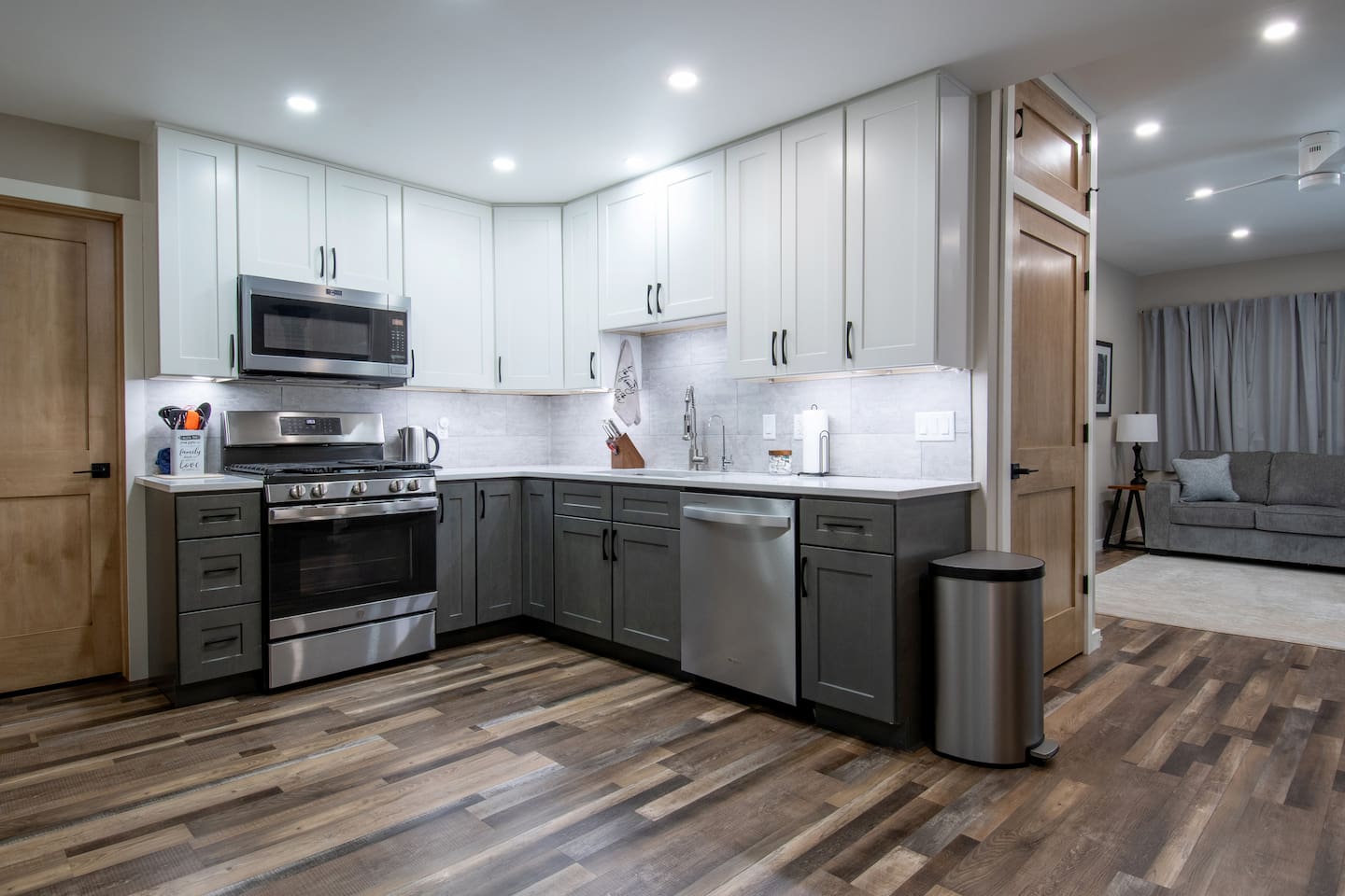 Amply stocked kitchen with quartz counters. Reverse osmosis water faucet located at sink.