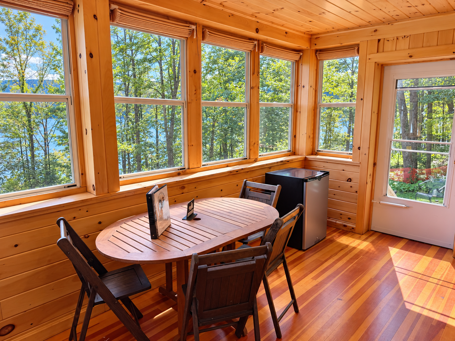 Dining area on sleeping porch with mini fridge