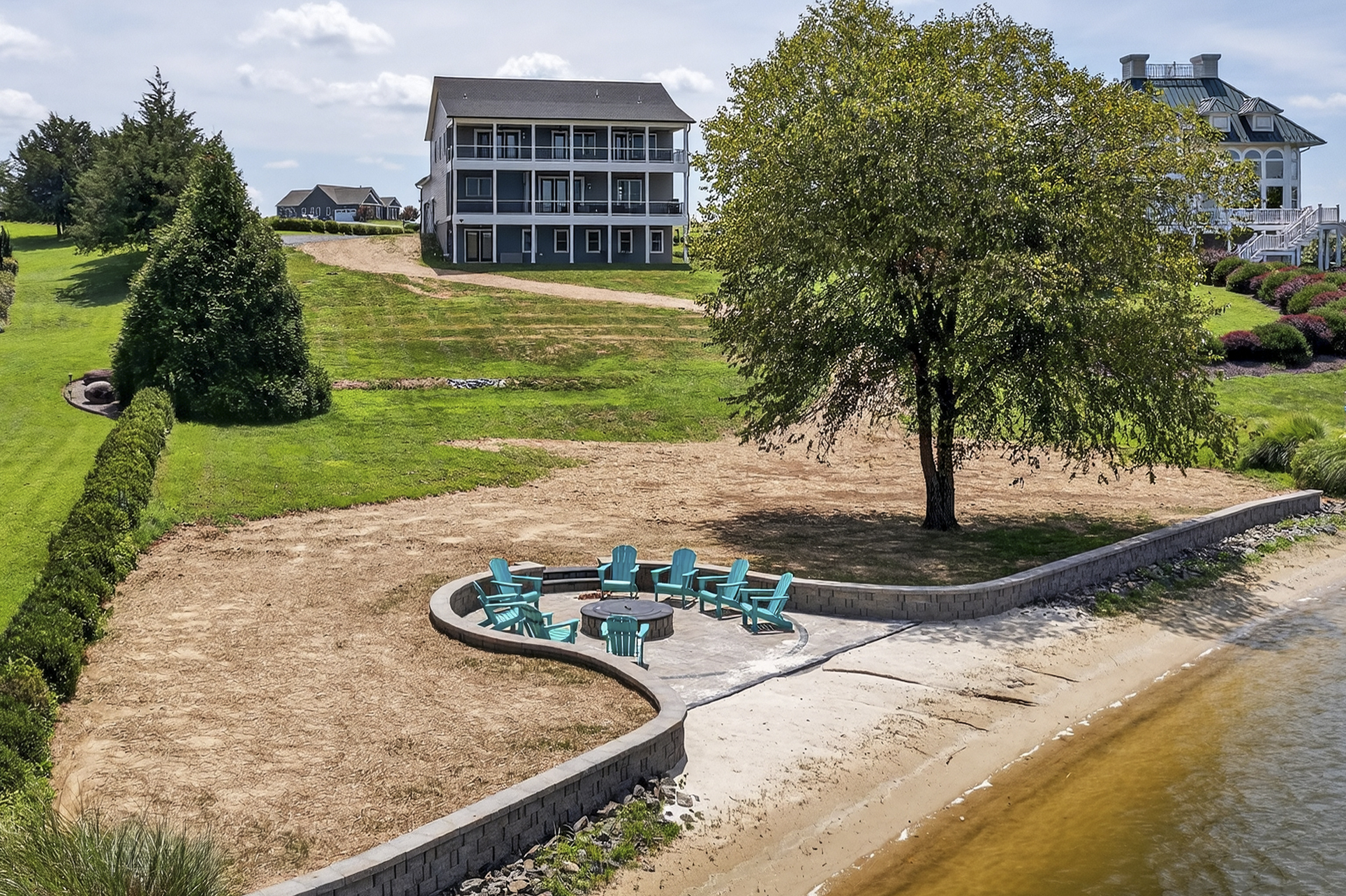 Experience Lake Anna like never before—private sandy beach, firepit under the shade of a lakeside tree, and endless water views to recharge your spirit.