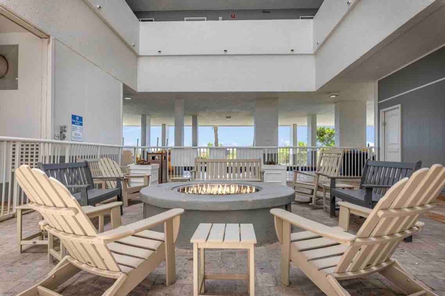 Fire pit located near elevators that are near the indoor pool area 