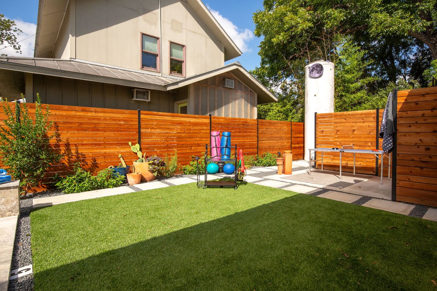 Private green space for yoga, sunning, or a light workout with included mats, bands & equipment provided.