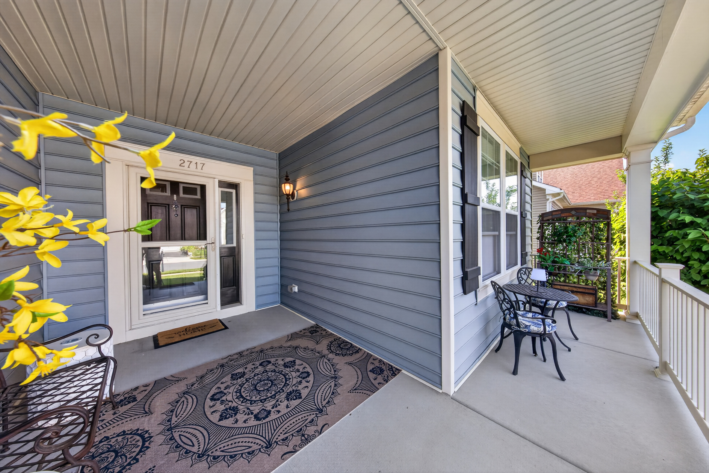 Greet the neighbors as you sit on the front porch passing the time