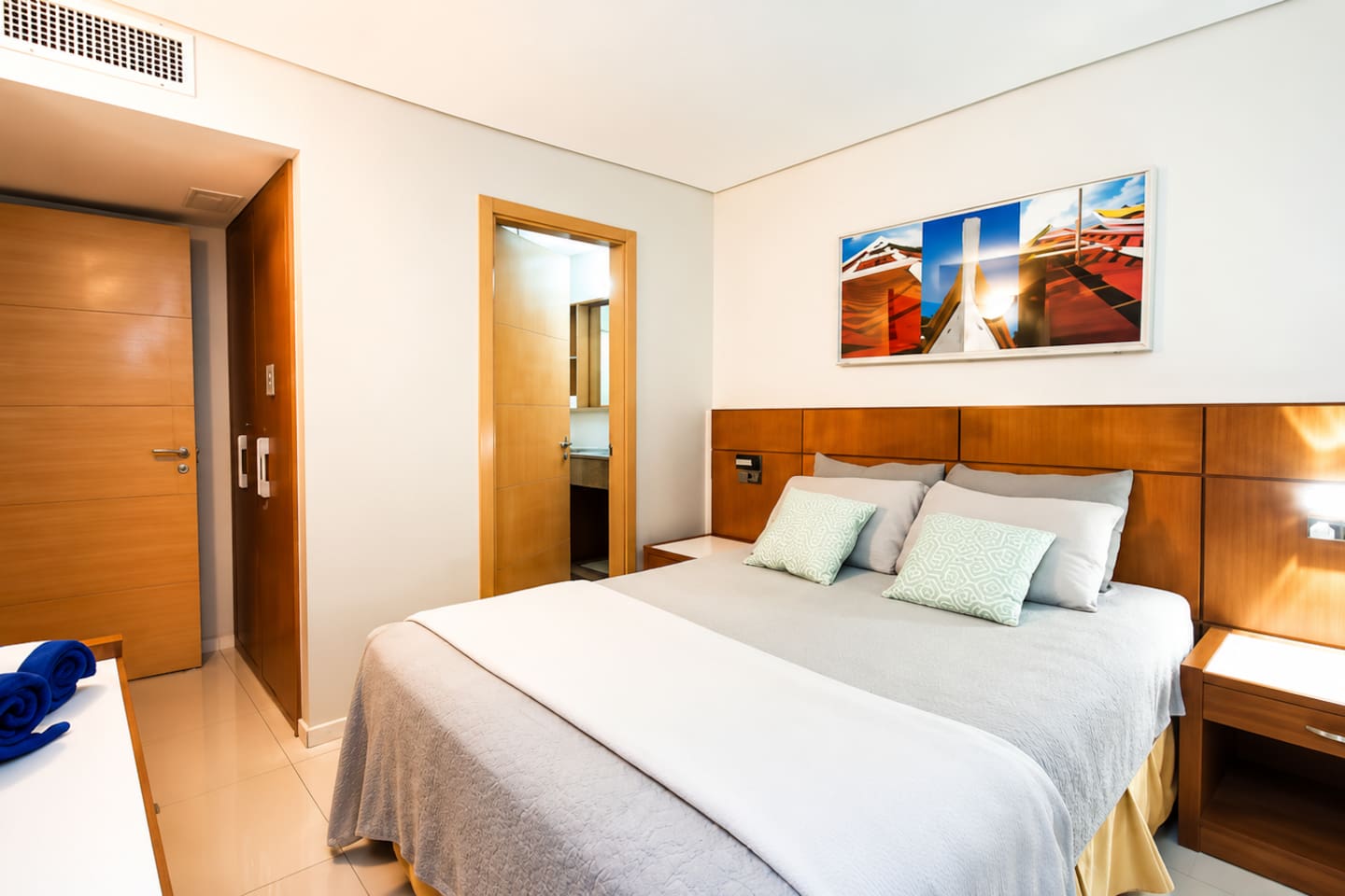 Bedroom 1 with an ensuite bathroom and direct access to the patio.