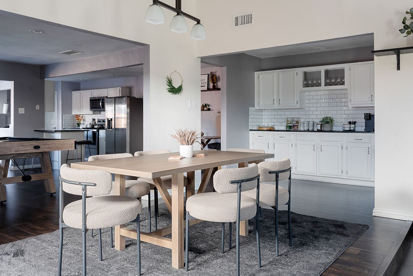 Enjoy the comfortable dining room chairs and gather around the table for morning coffee or a delicious, home-cooked meal. There is a coffee bar to make mornings delightful and a pool table to make memories with your group!