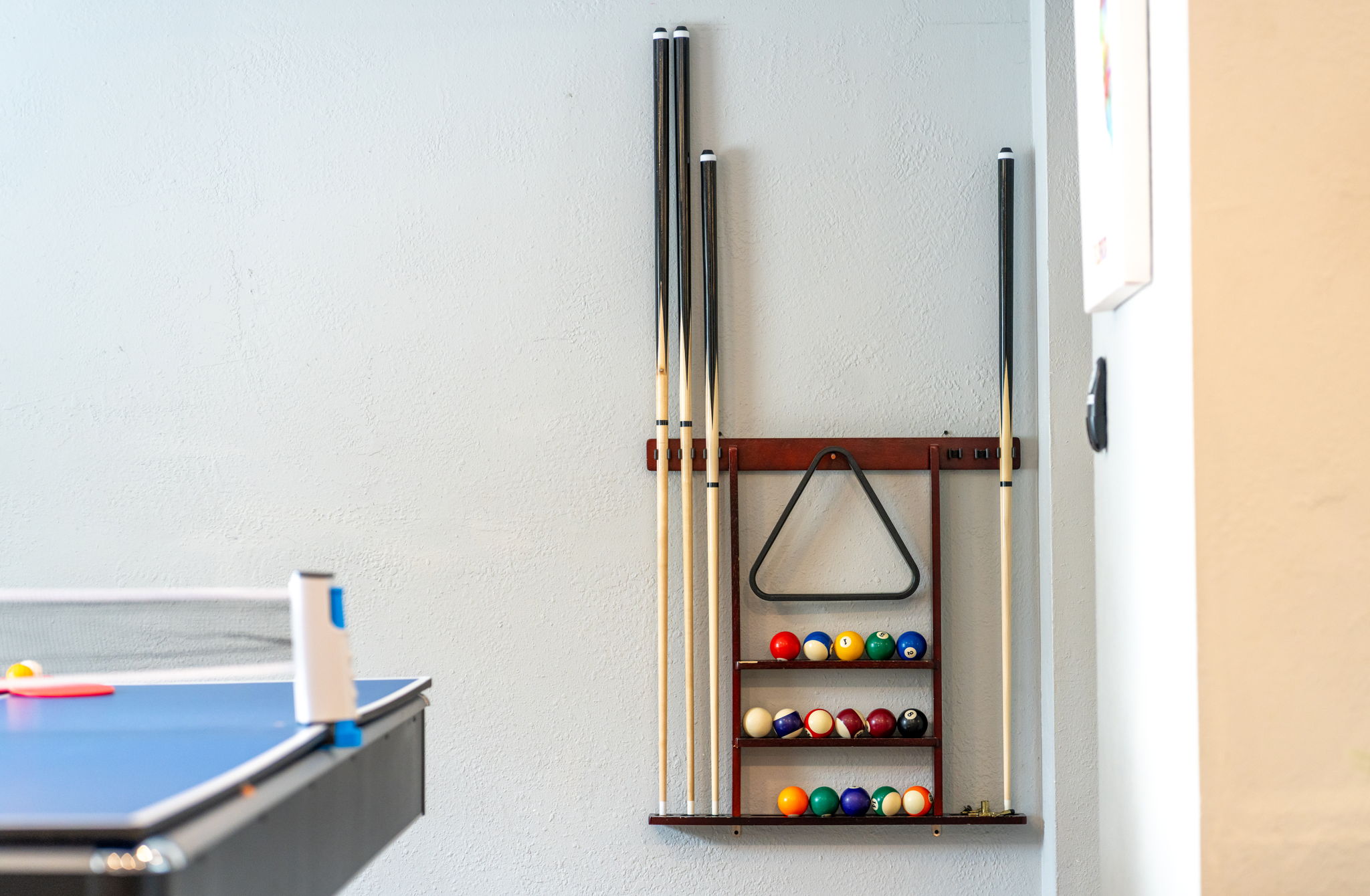 With tournament-ready tables, relaxed lounge seating nearby, and vibrant decor, this game room sets the mood for memory-making.