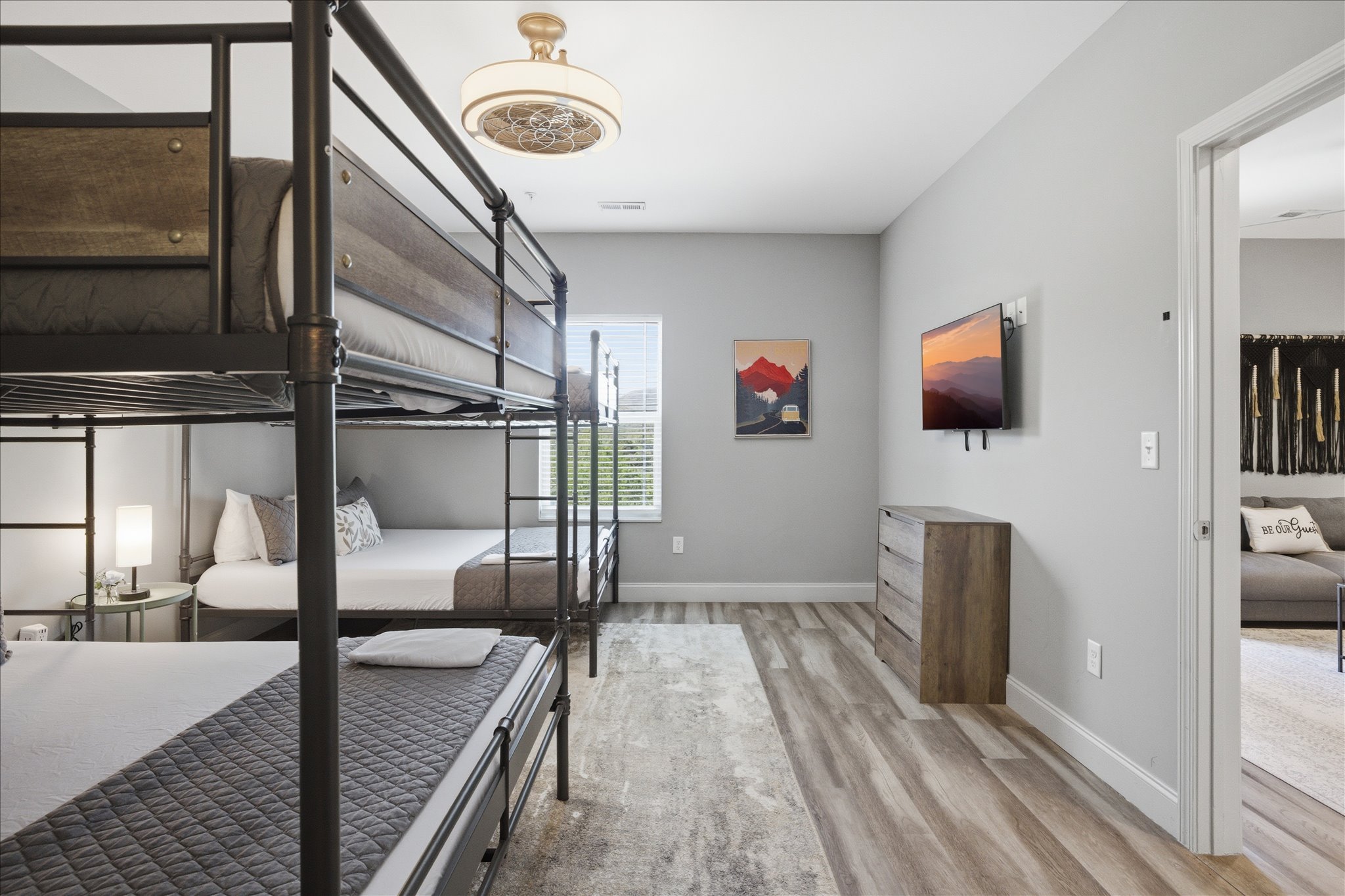 There’s a rhythm to this room in Unit 2—bags tucked away, people coming and going, and enough space to keep it all from feeling chaotic. It just works.
