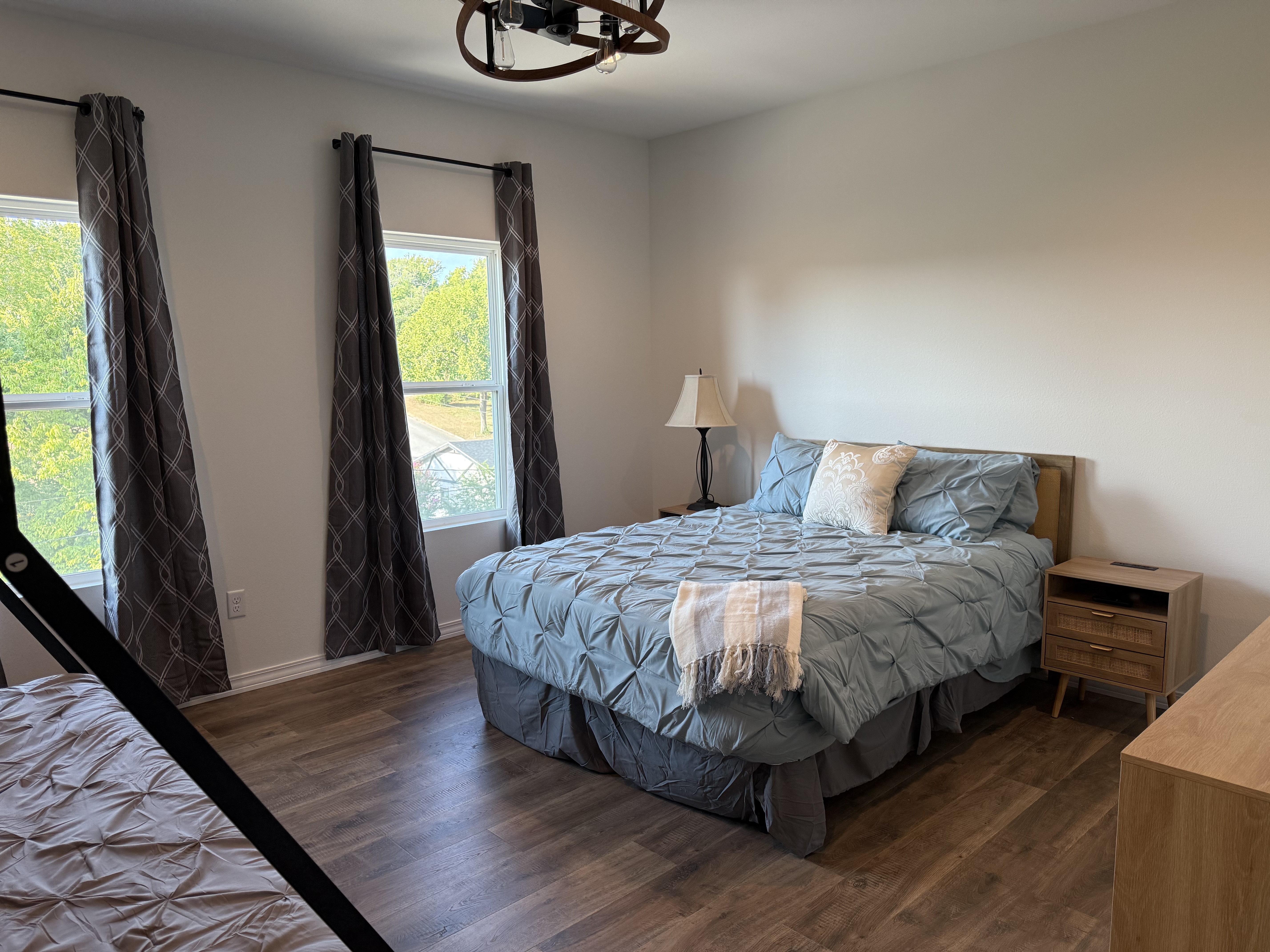 Bedroom #3 has a Queen bed and a set of Bunks. Lower bunk in a Queen and upper is a twin xl. Room is large enough to provide this amount of bedding and still have room to move around. Dresser and night stands also in room