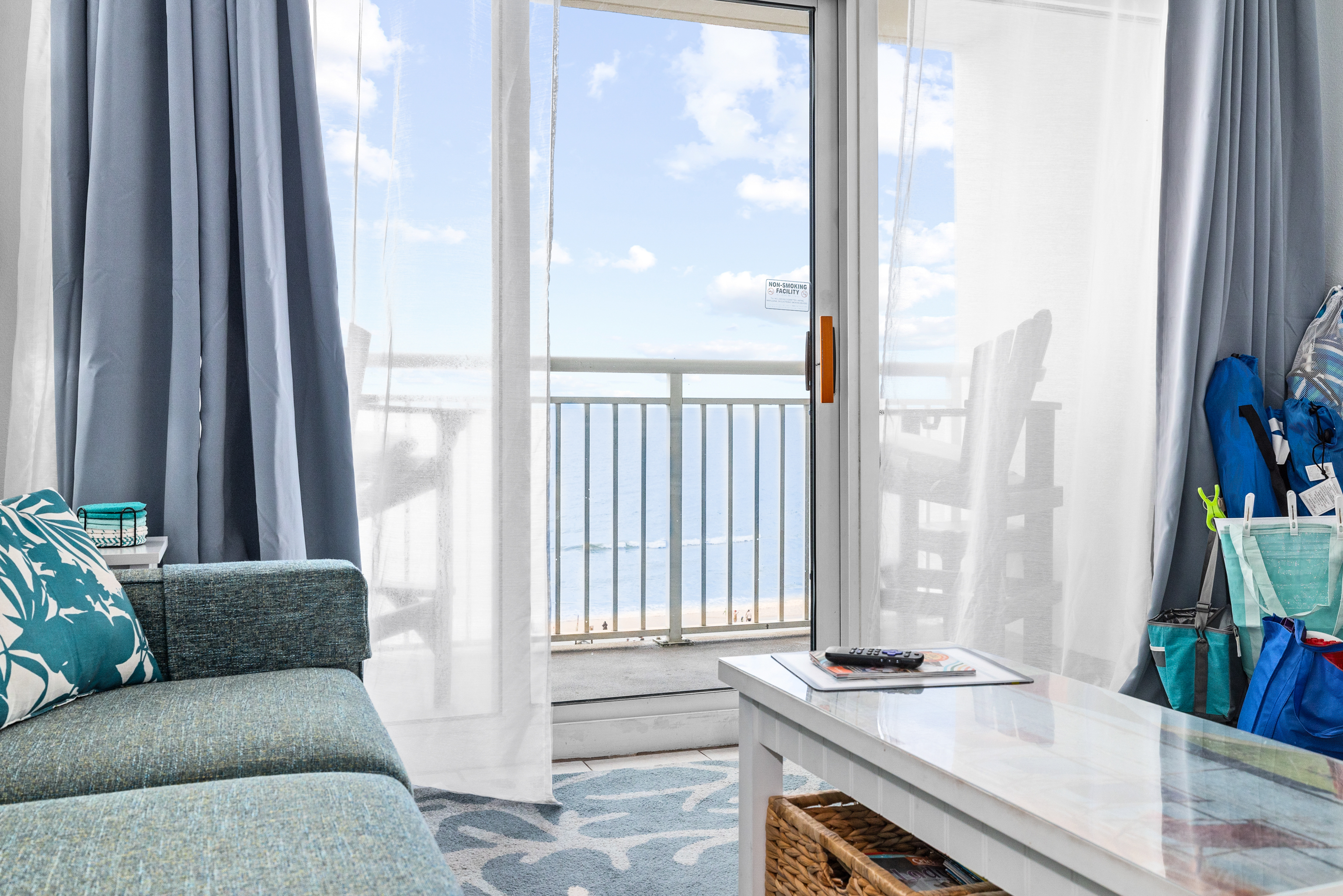 Bright, breezy living space that opens to the balcony.