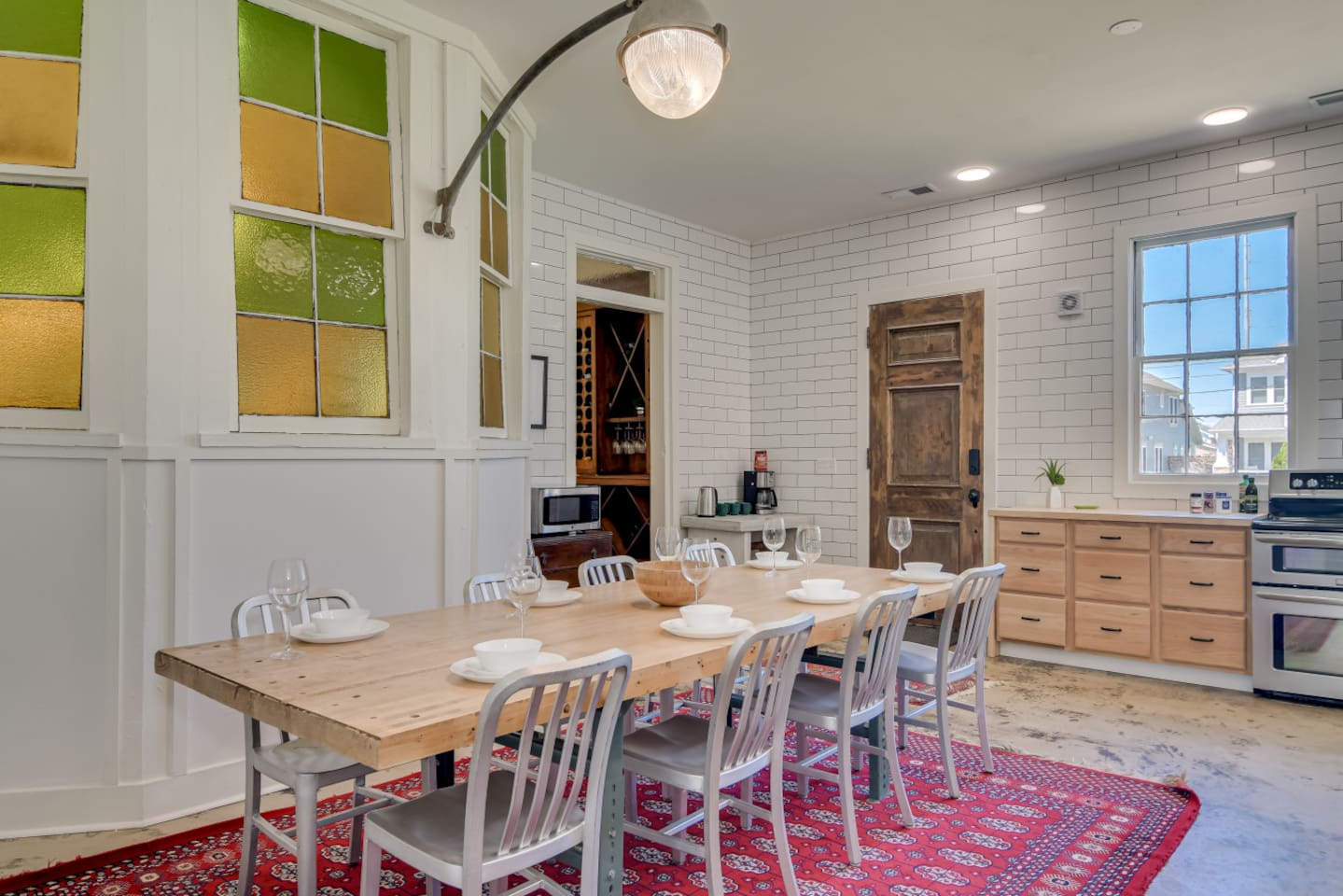 Dining hall with long table, perfect for group meals and celebrations.
