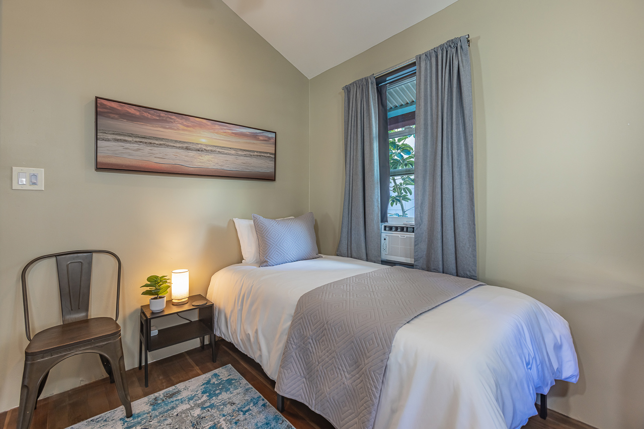 1 of 2 Twin Beds in Guest Room