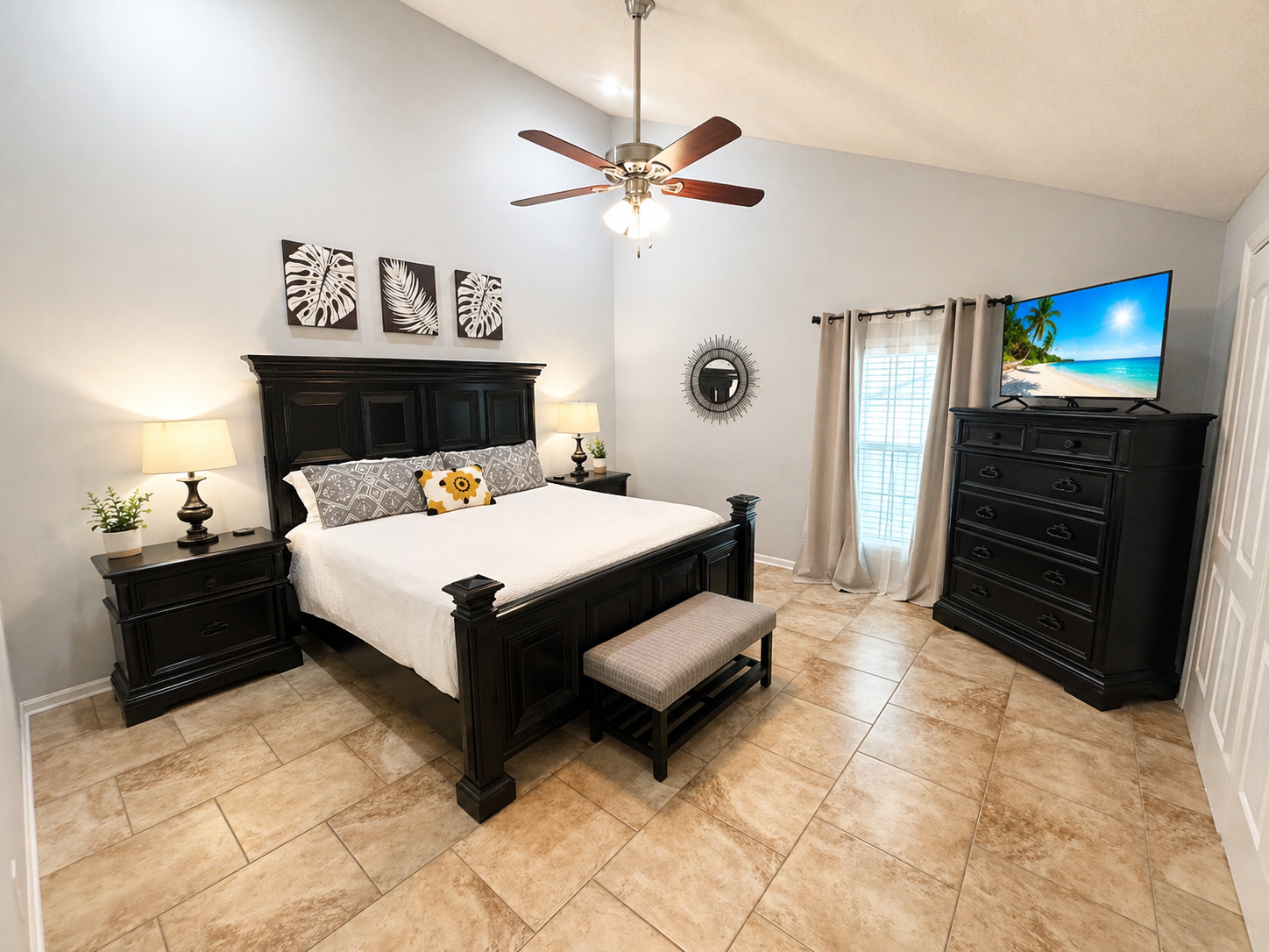 Master bedroom with king bed and vaulted ceilings