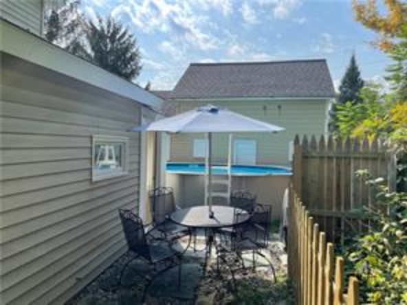 Cooperstown Cottage outdoor seating and grilling area right next to the pool. **Pool Closed after Labor Day**