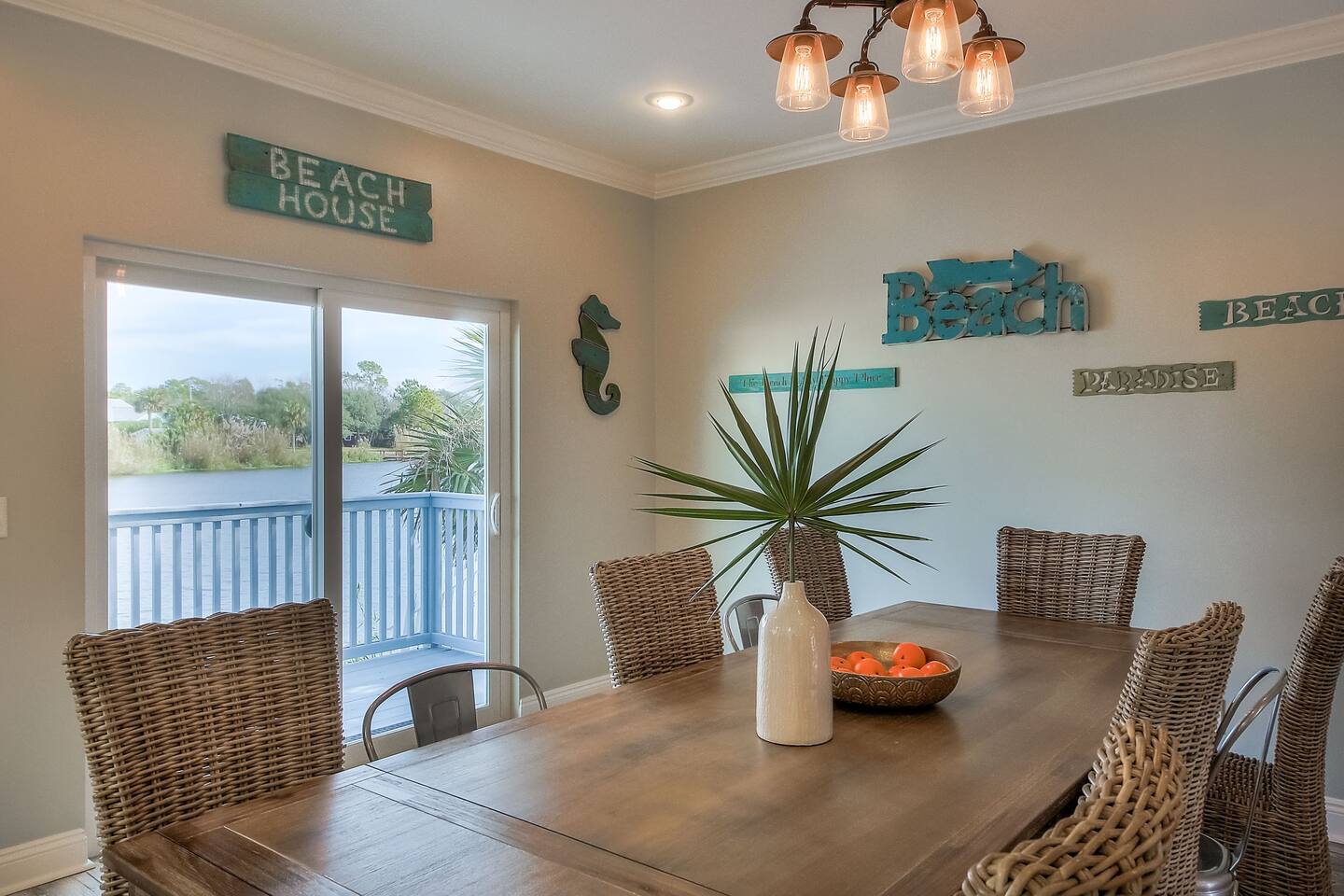 There’s enough room for everyone at the lovely farmhouse table with willow chairs and French bistro chairs.