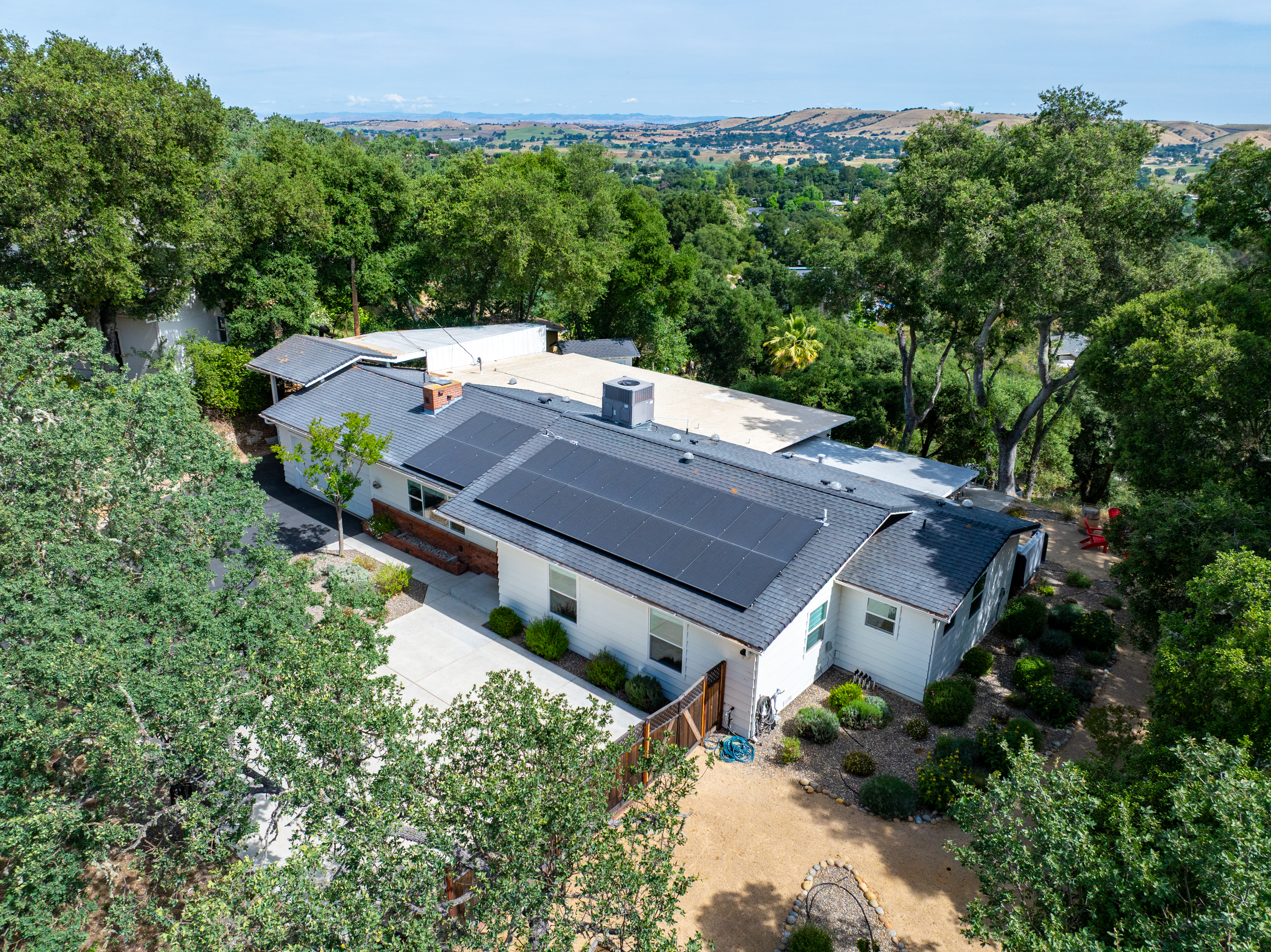 Your secluded hilltop escape, nestled among the oaks with views for miles.