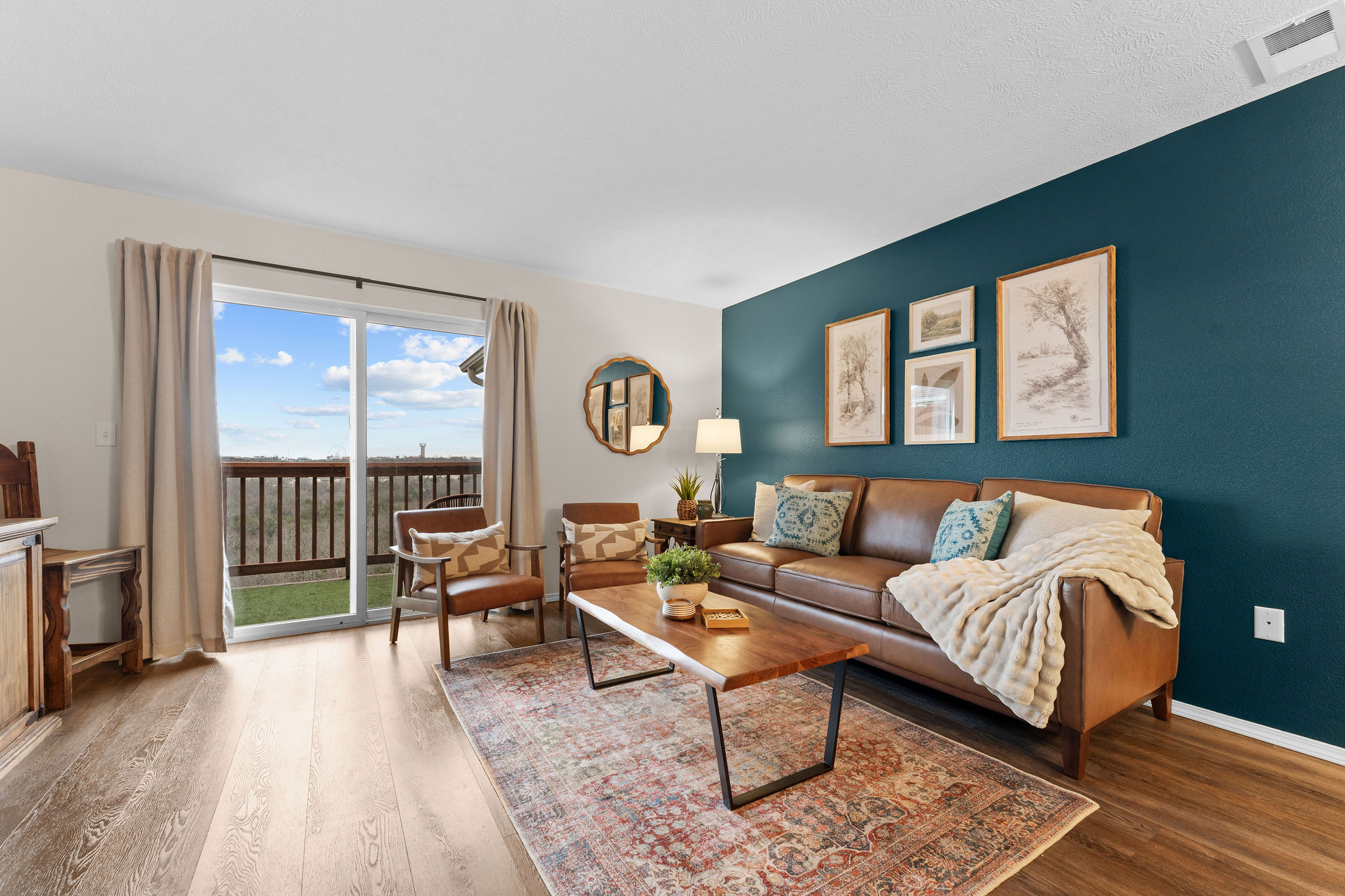 Living room with balcony and scenic views