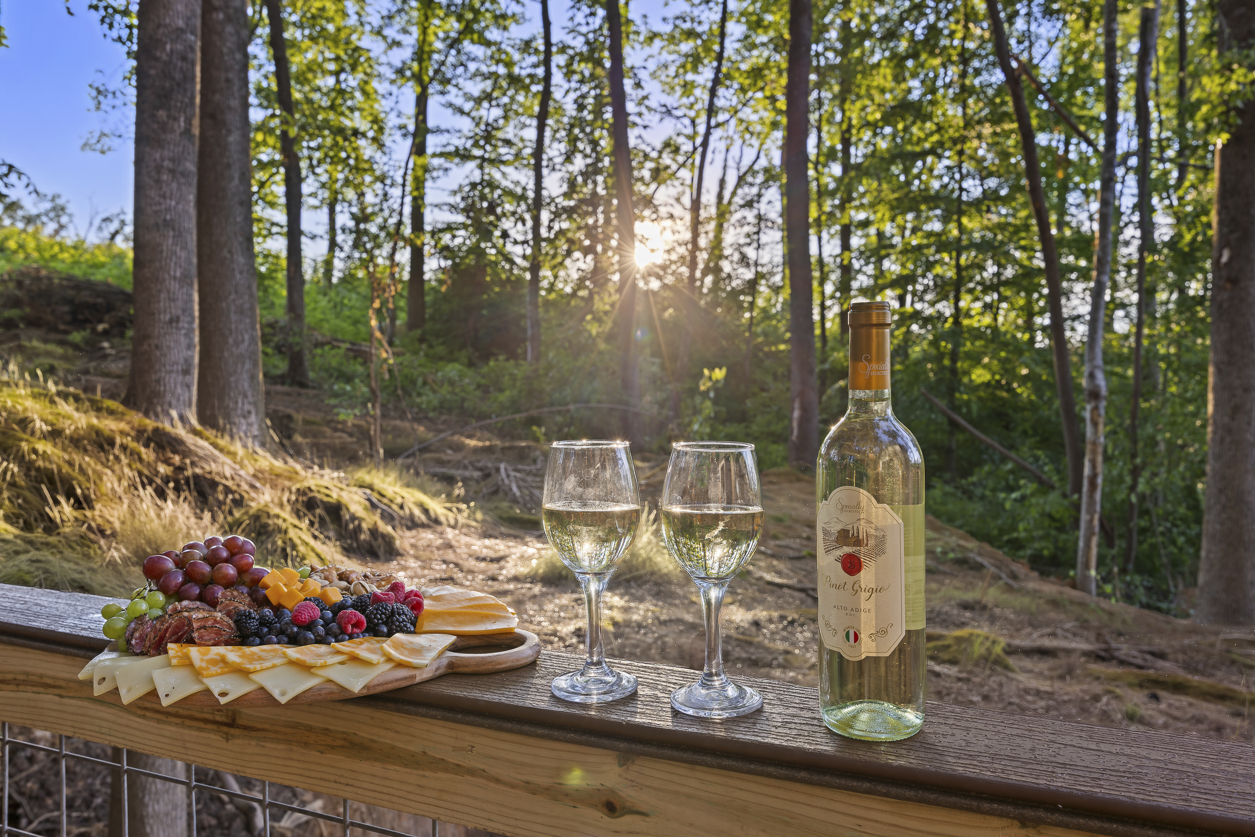 Deck Oasis: Unwind with wine and cheese while soaking in serene forest views at sunset!