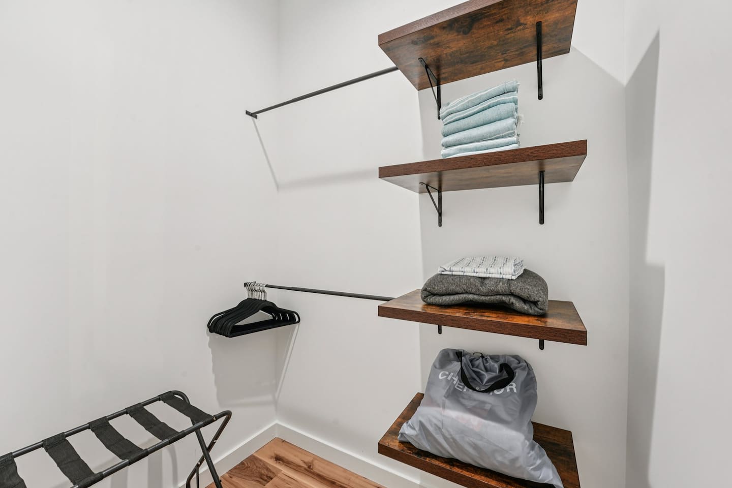 Suitcase holder, air mattress, and beach towels located here