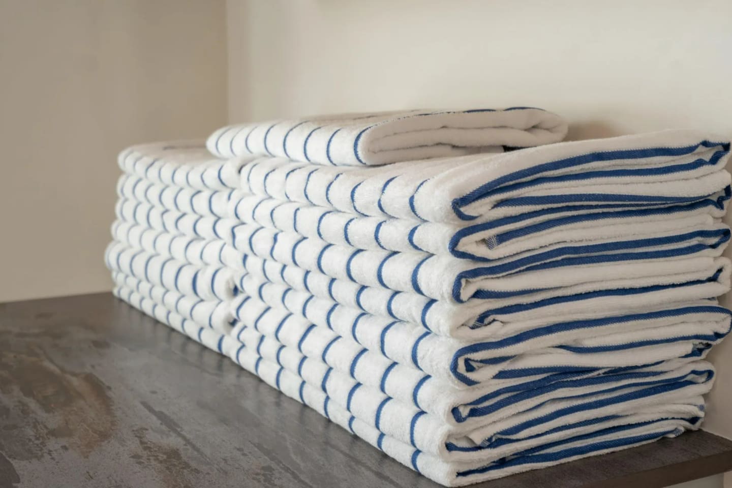 Fresh, neatly stacked towels are ready and waiting for every guest.