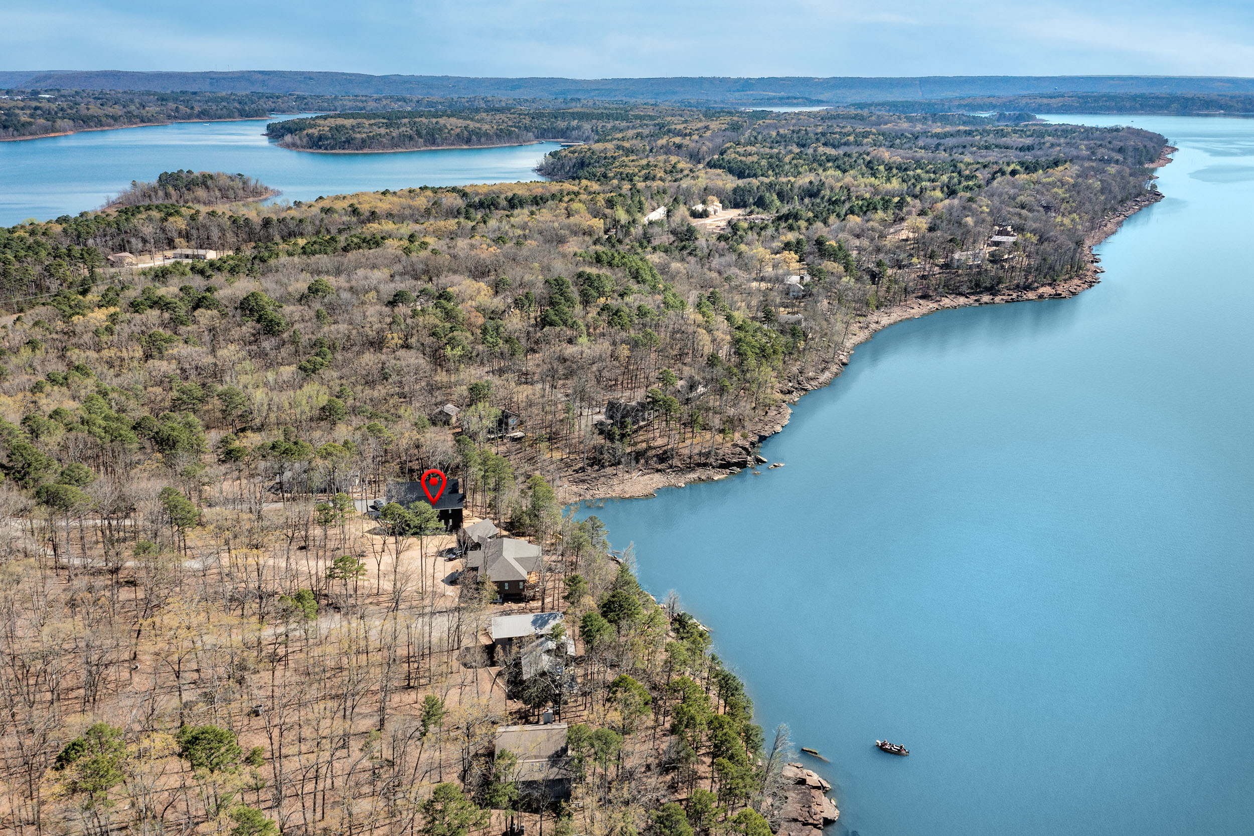 Tucked into the trees and just steps from the lake, Sunset Cove Getaway offers a private escape with unbeatable Greers Ferry views