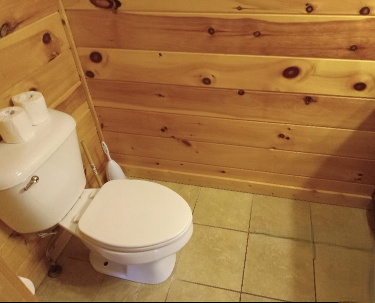 Half bathroom conveniently located off the kitchen on the main level