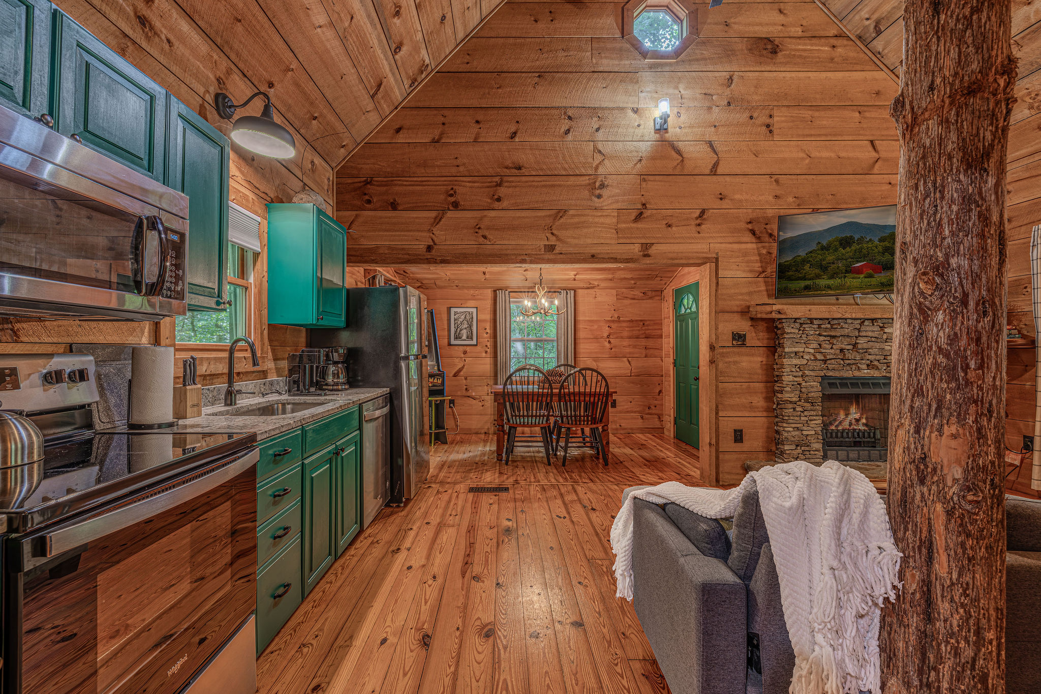 Kitchen, fireplace, and a whole lot of cabin character.
