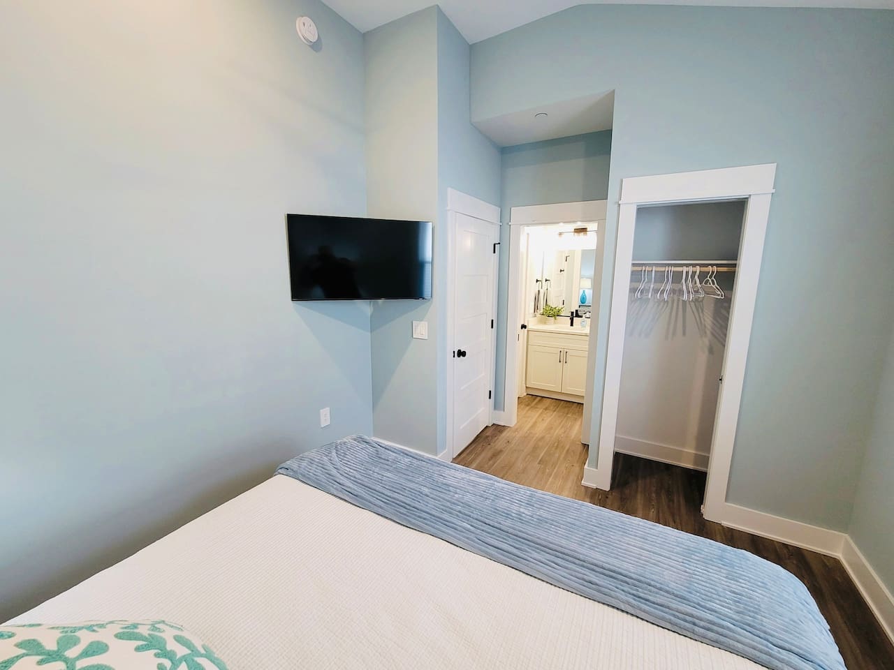 King bedroom has direct access via pocket door to the guest bathroom.   Also has large closet with shelves.