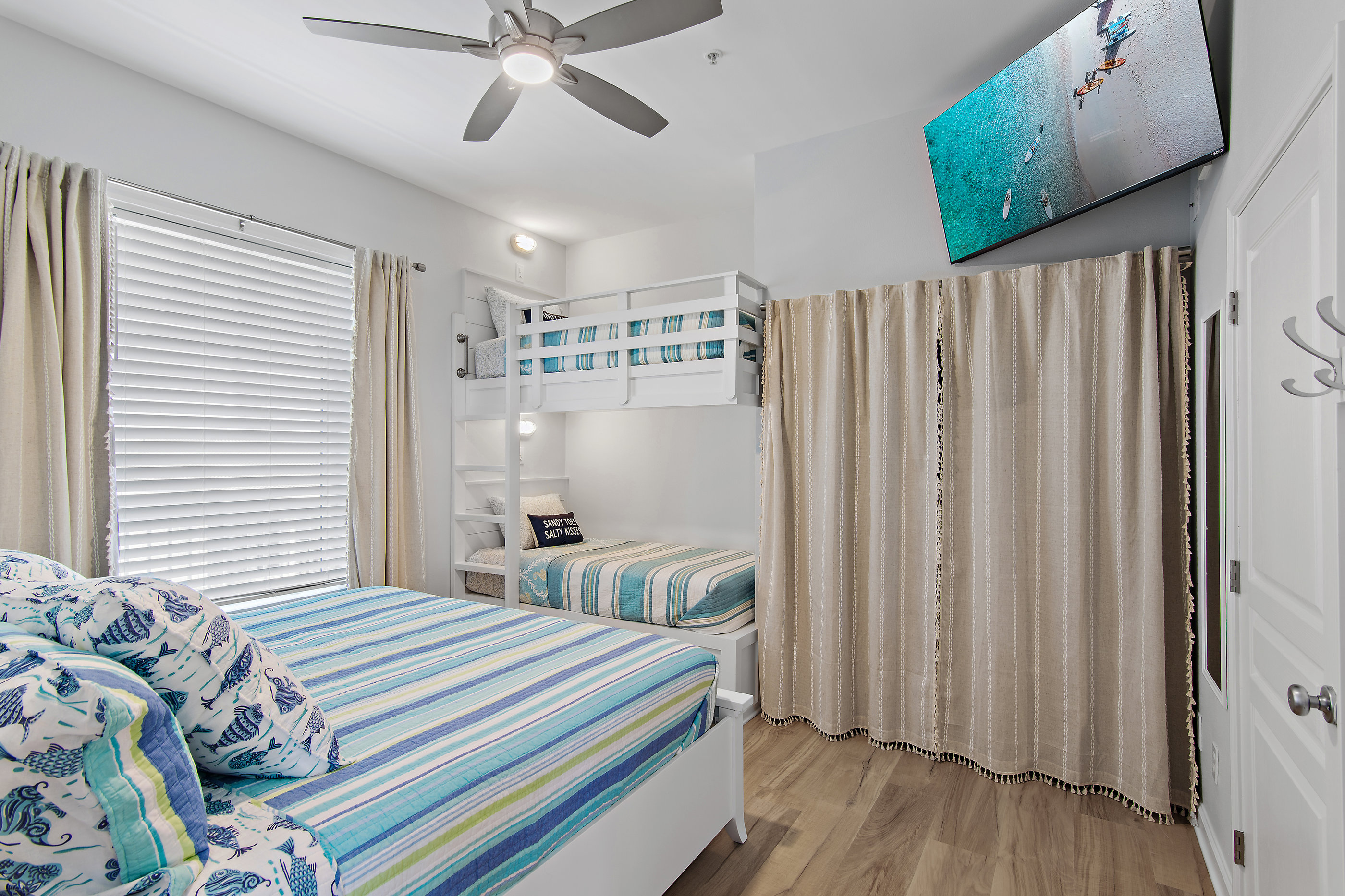 King bunk suite with wall‑mounted Smart TV