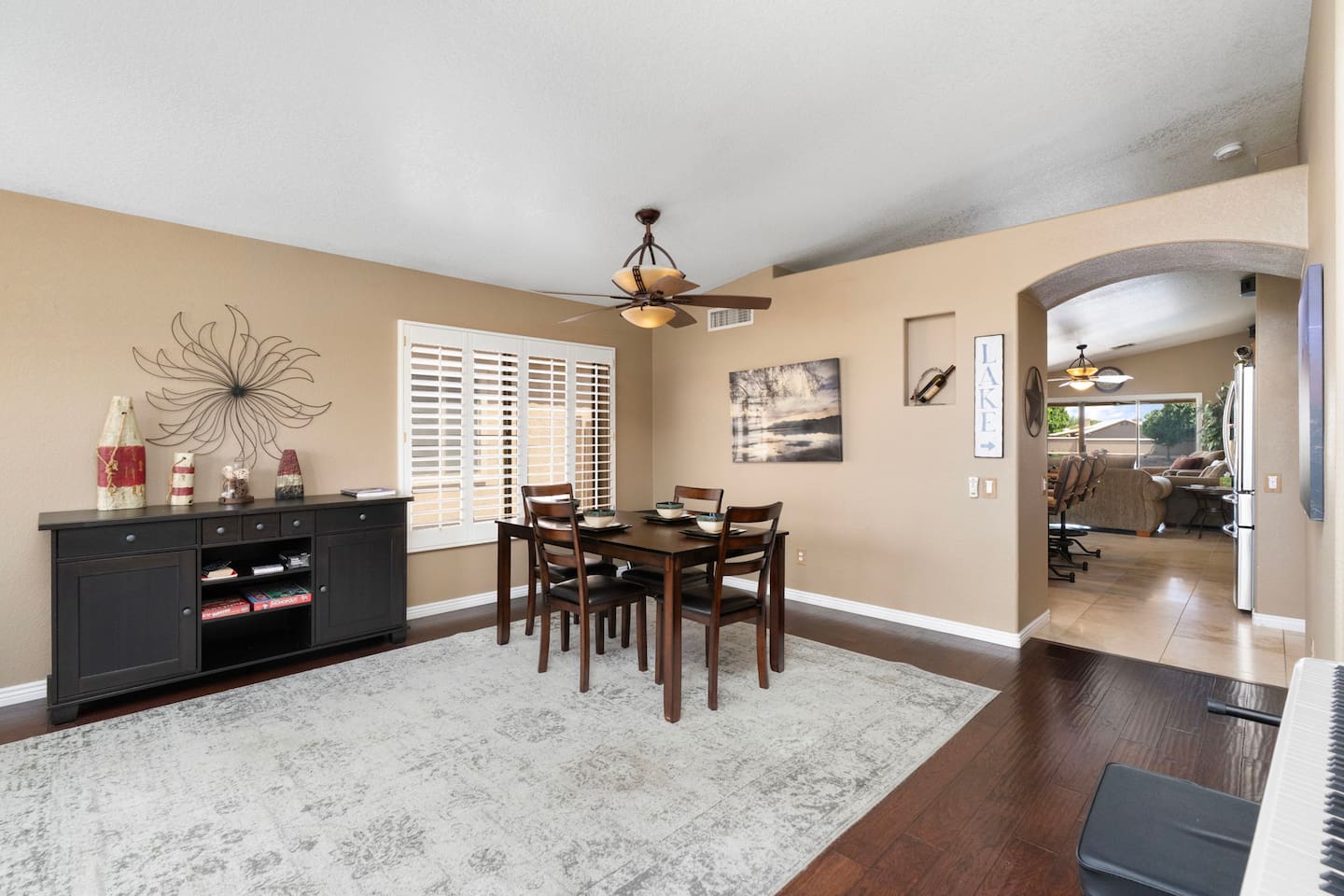 A dedicated dining space with room to spread out, paired with a stylish sideboard stocked with games — great for post-dinner Monopoly nights with the family.