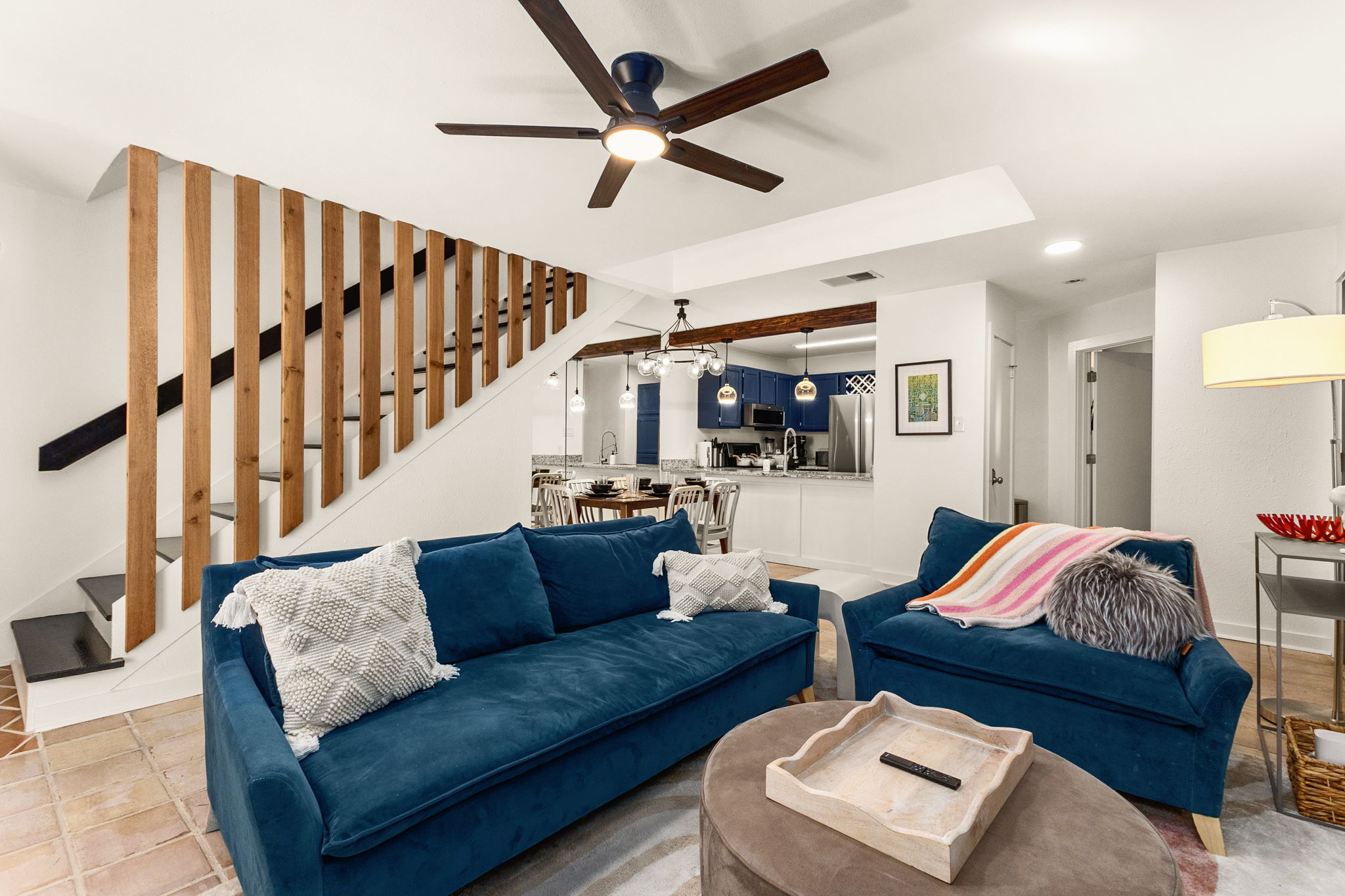 Cozy living area with blue sectional – plenty of space for everyone to spread out