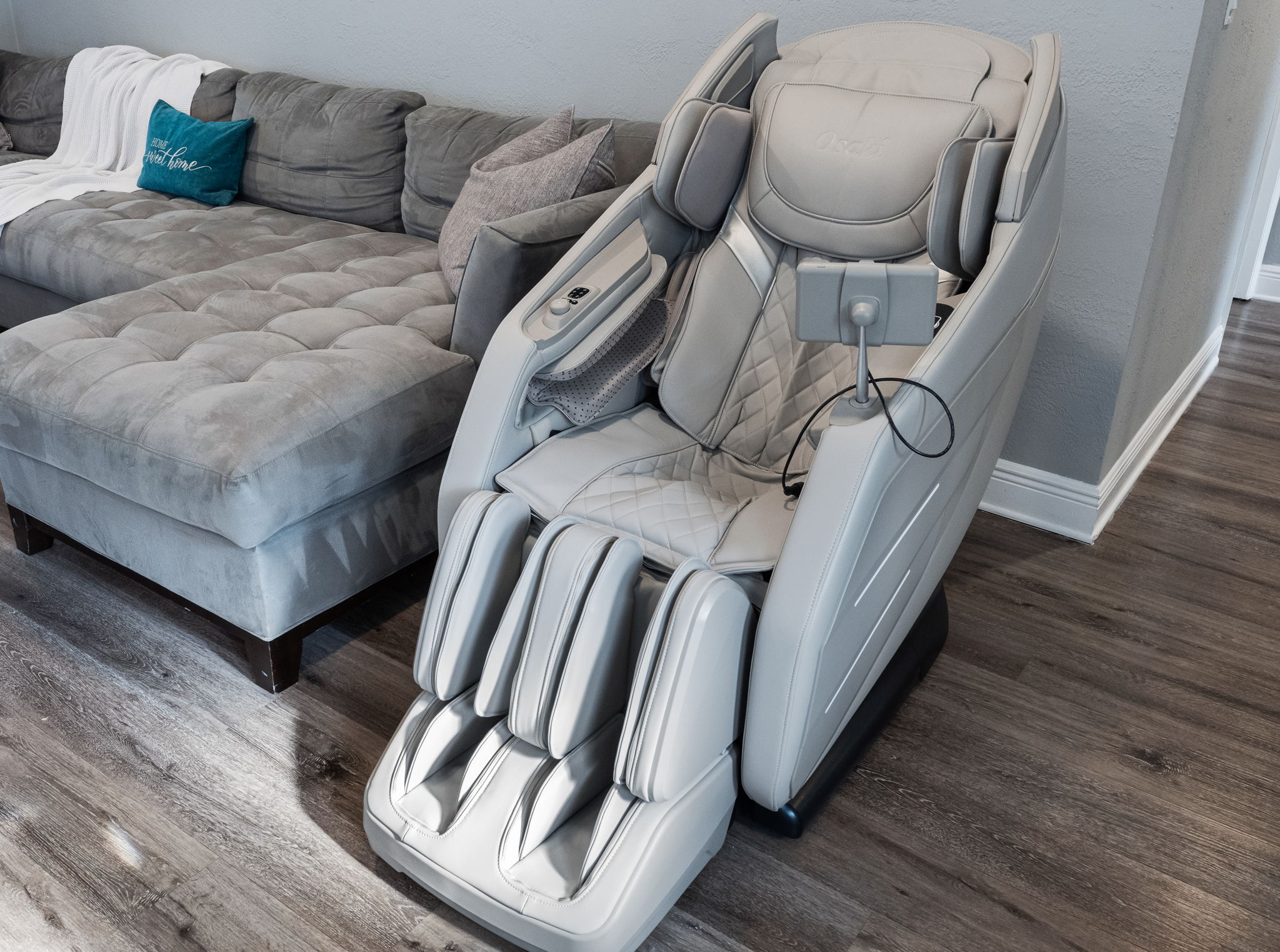 Sink into this state-of-the-art Osaki massage chair, designed to deliver full-body relief with customizable settings for your perfect unwind.