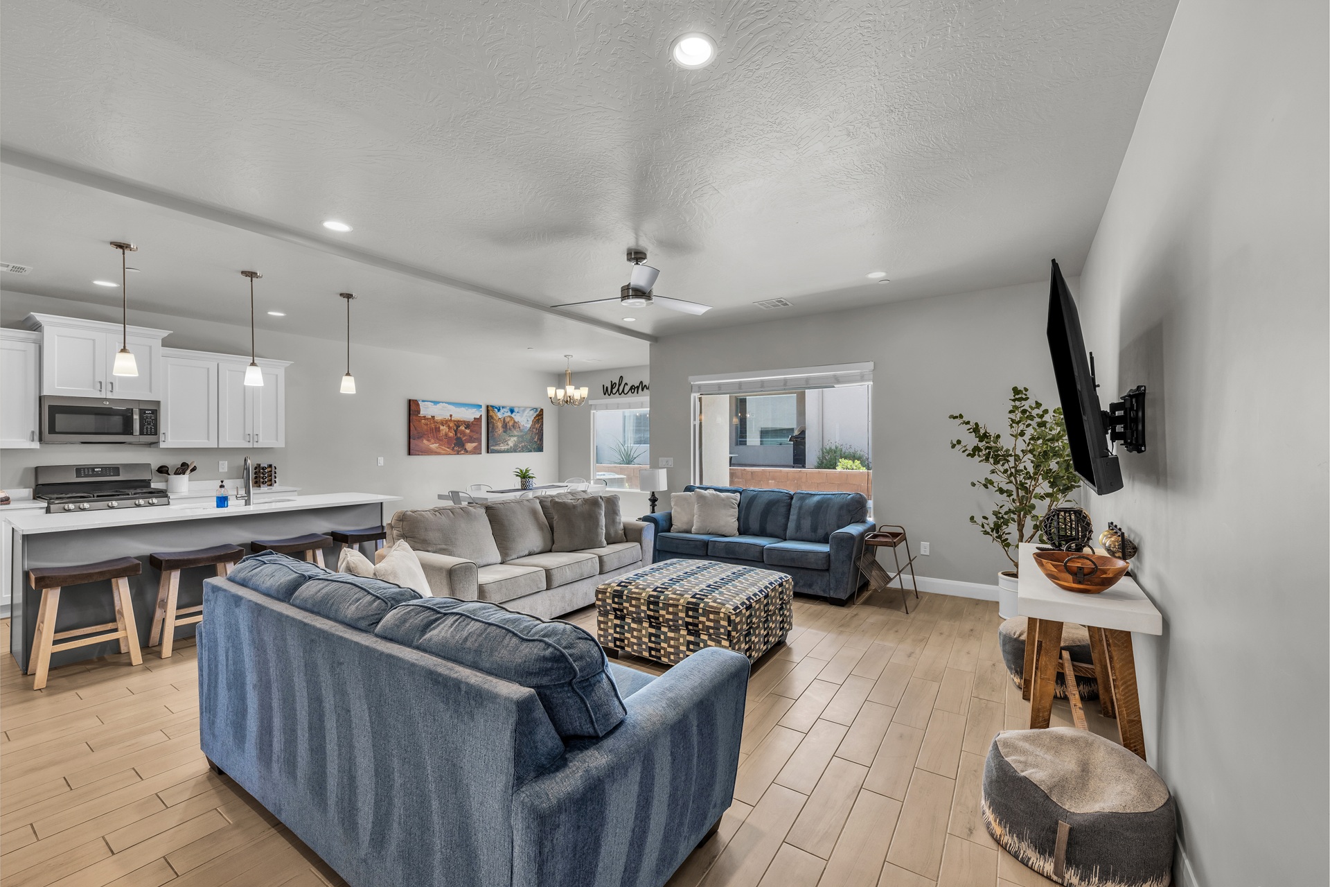 Open-concept living with TV & sofa beds