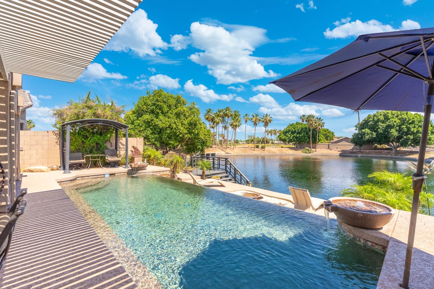 Lounge poolside under the pergola shade, stroll down to the lake dock, or just soak in the view — the backyard gives you plenty of ways to spend a slow, sunny afternoon.