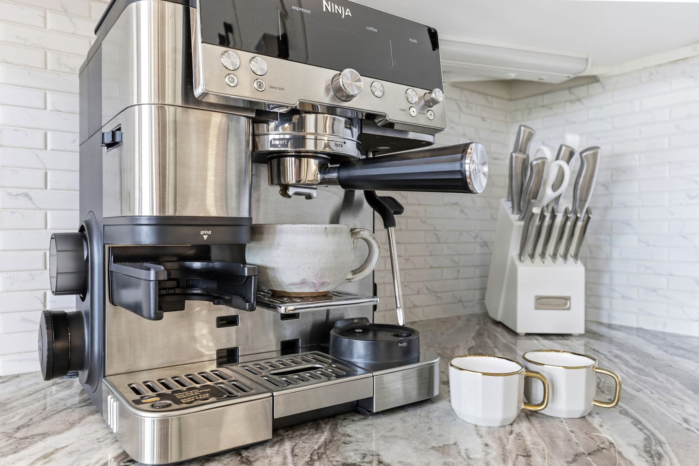 Start your mornings like a barista! This powerful Ninja espresso machine makes perfect cappuccinos, lattes, and your favorite coffee drinks with ease. Just add fresh whole beans and enjoy café-quality coffee right at home.