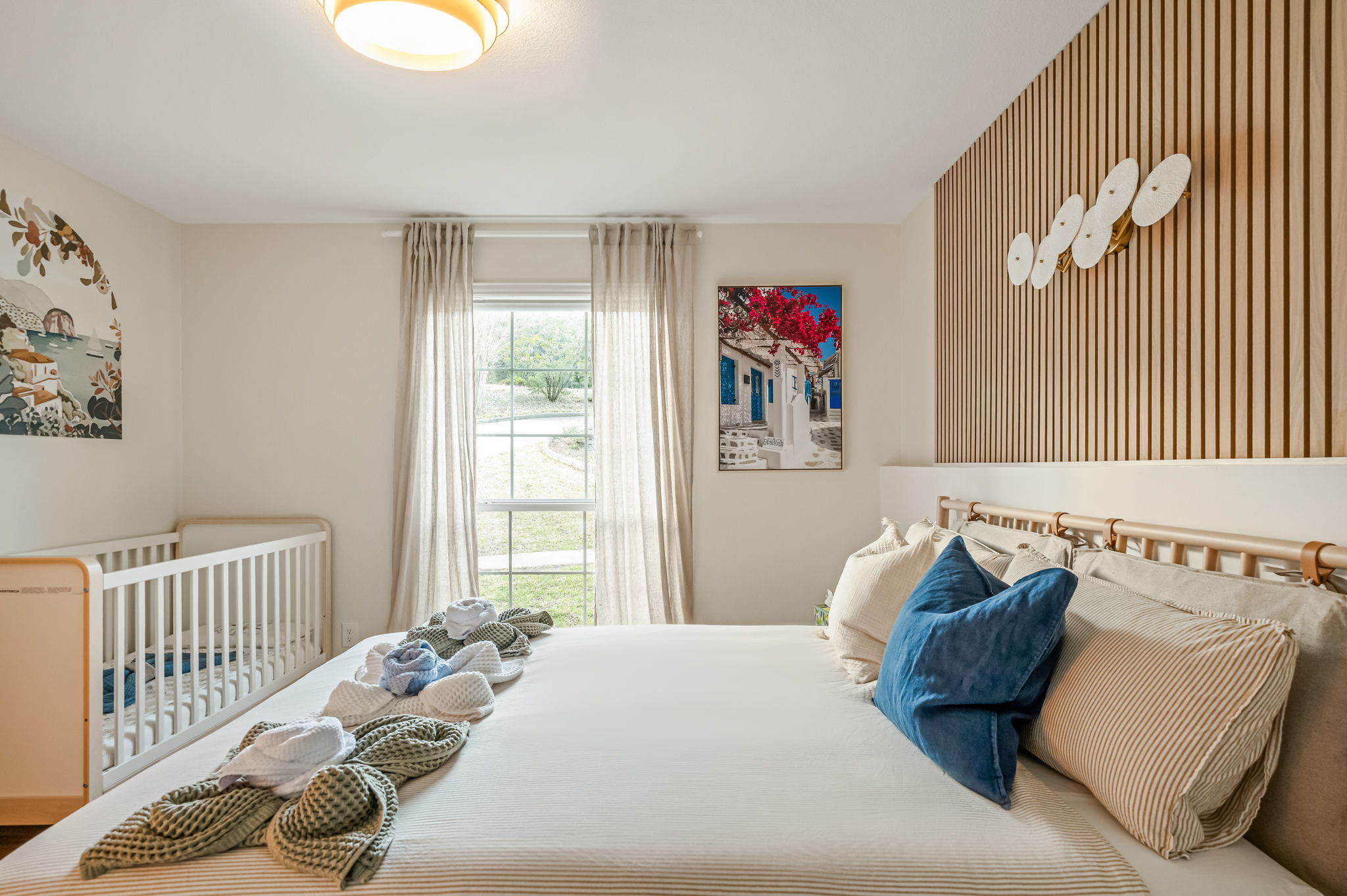 Bright and inviting bedroom with comfortable bedding — perfect for restful nights.